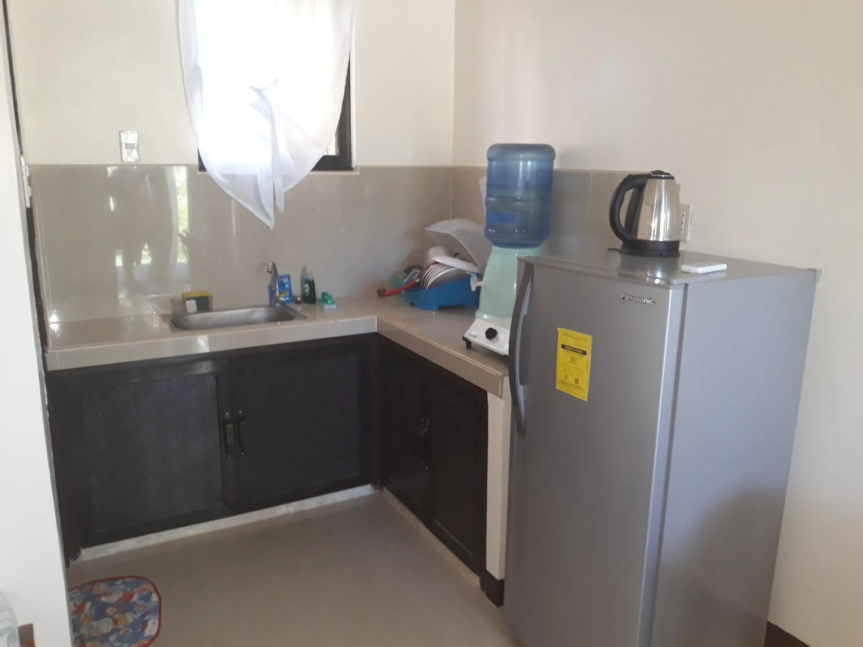 Kitchen or kitchenette in Gardenview Homestay Siargao