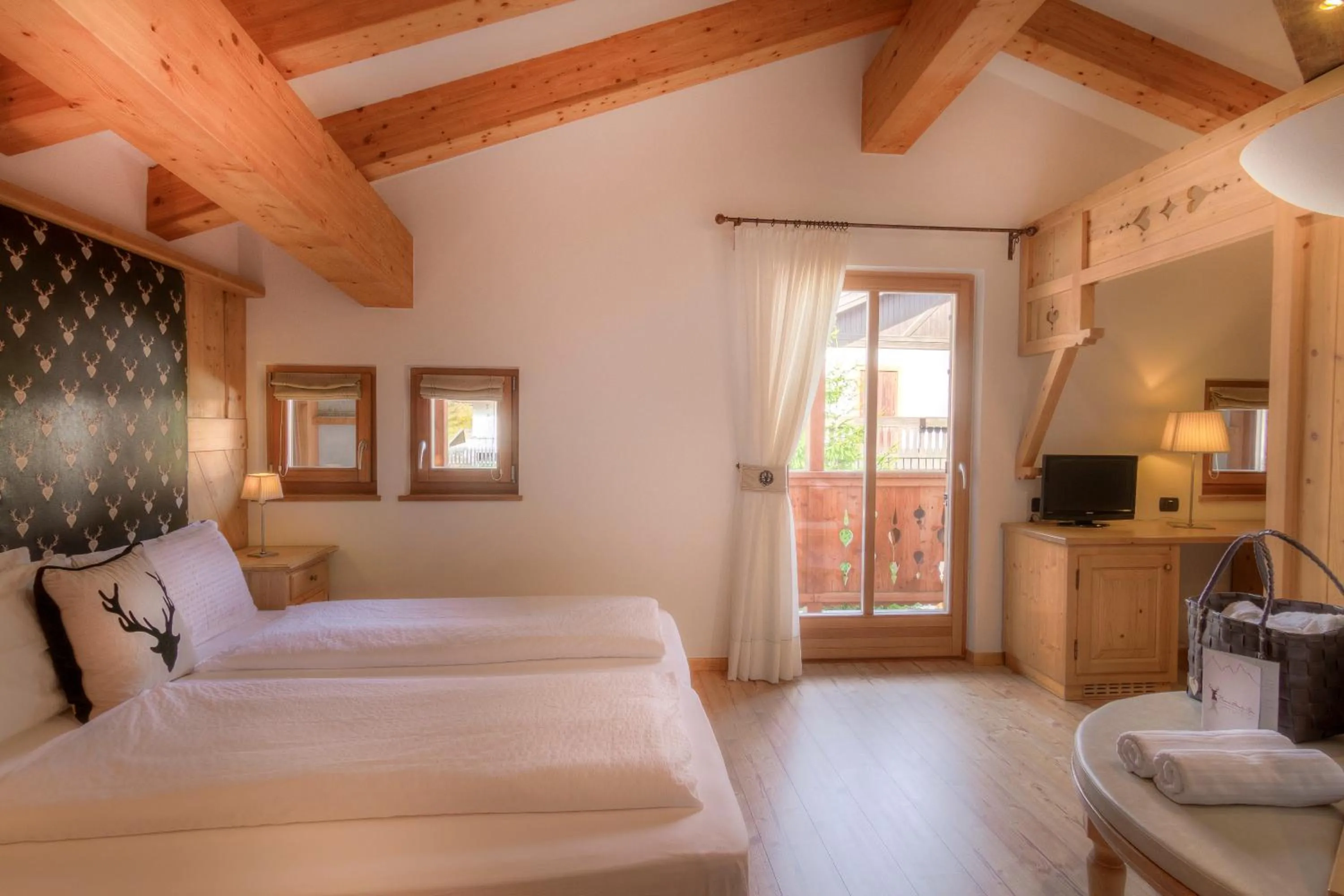 Bed in Hotel Madonnina Resort And Wellness