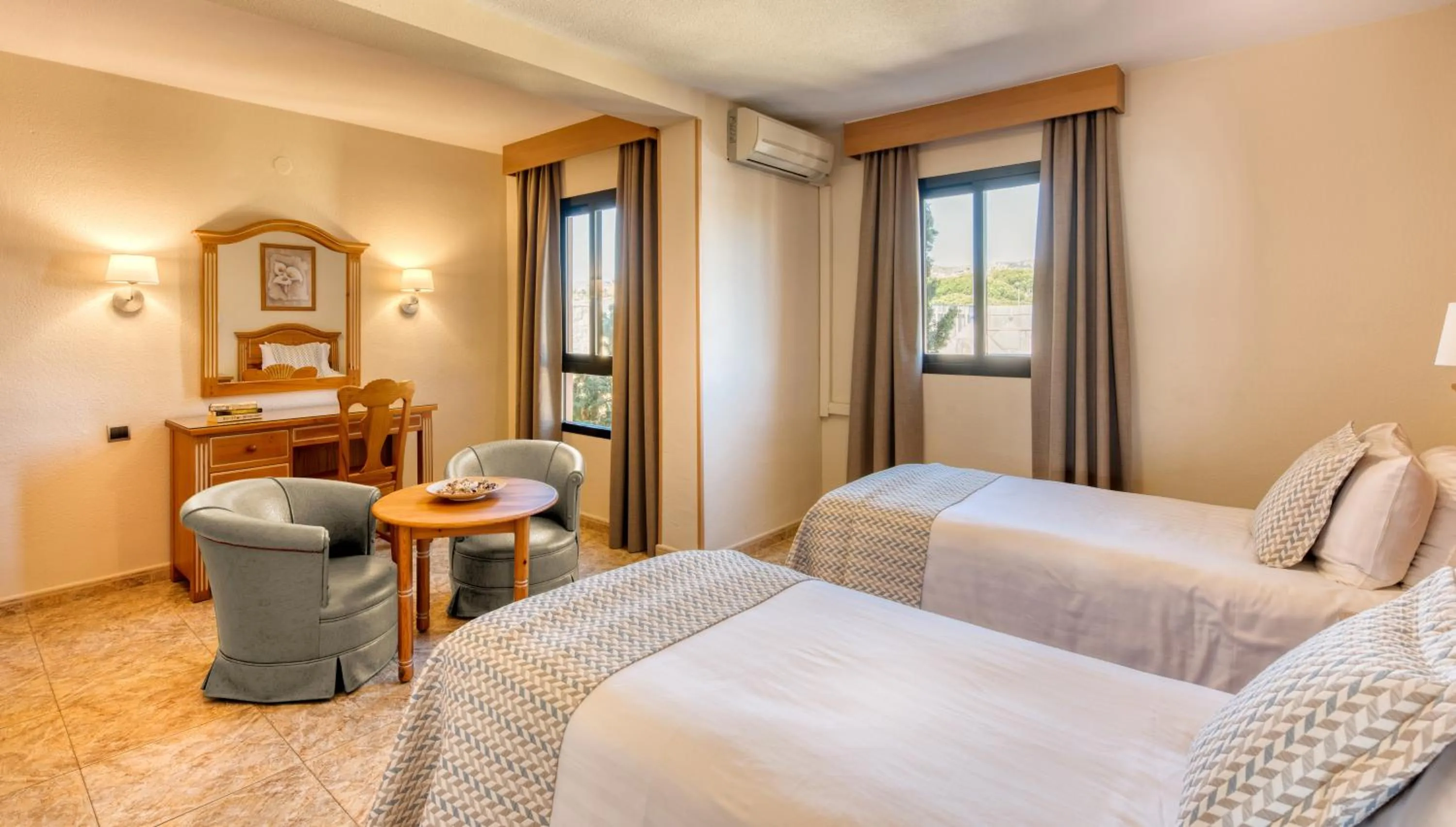 Seating area, Bed in Macdonald Doña Lola Resort