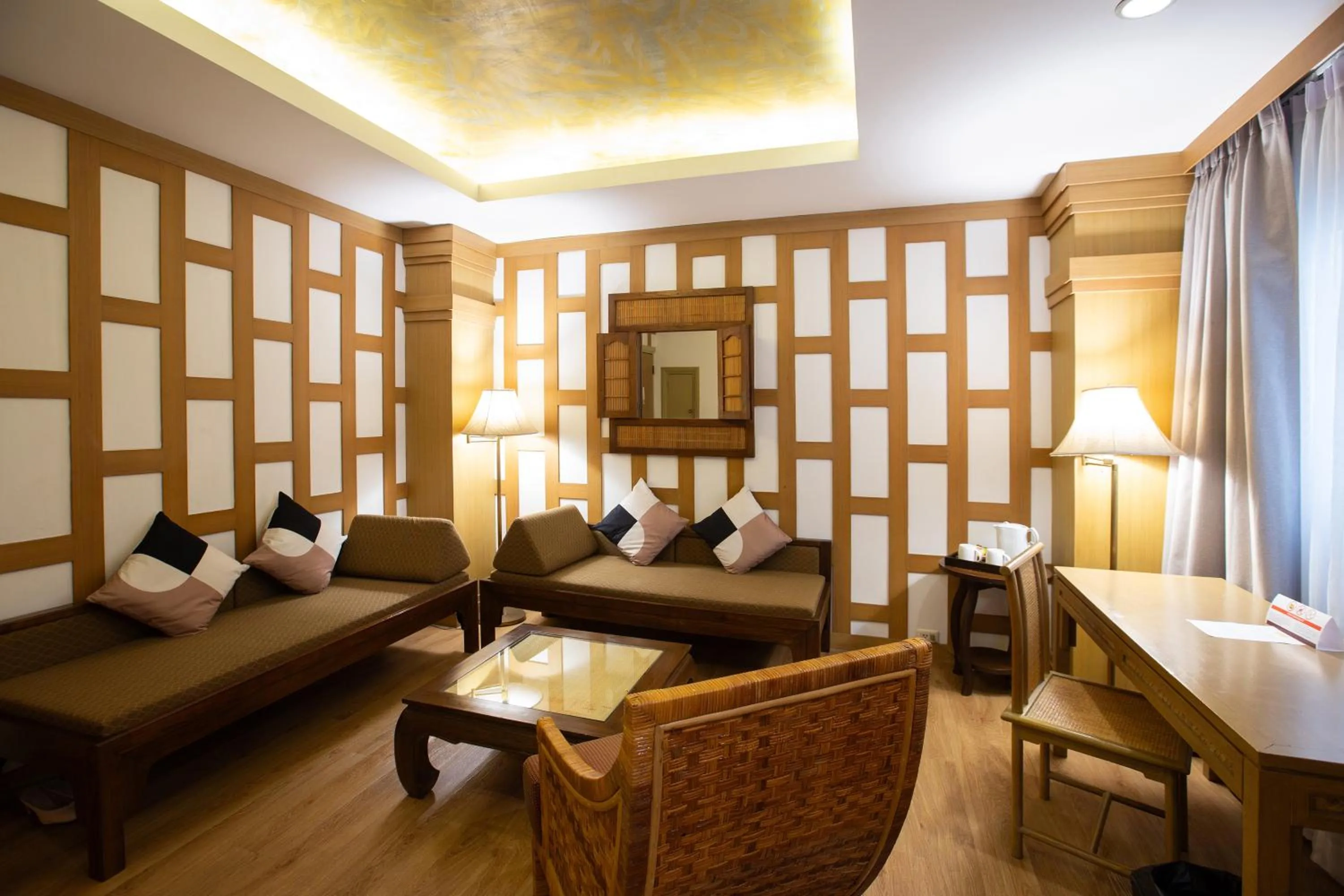 Living room in The Tarntawan Hotel Surawong Bangkok