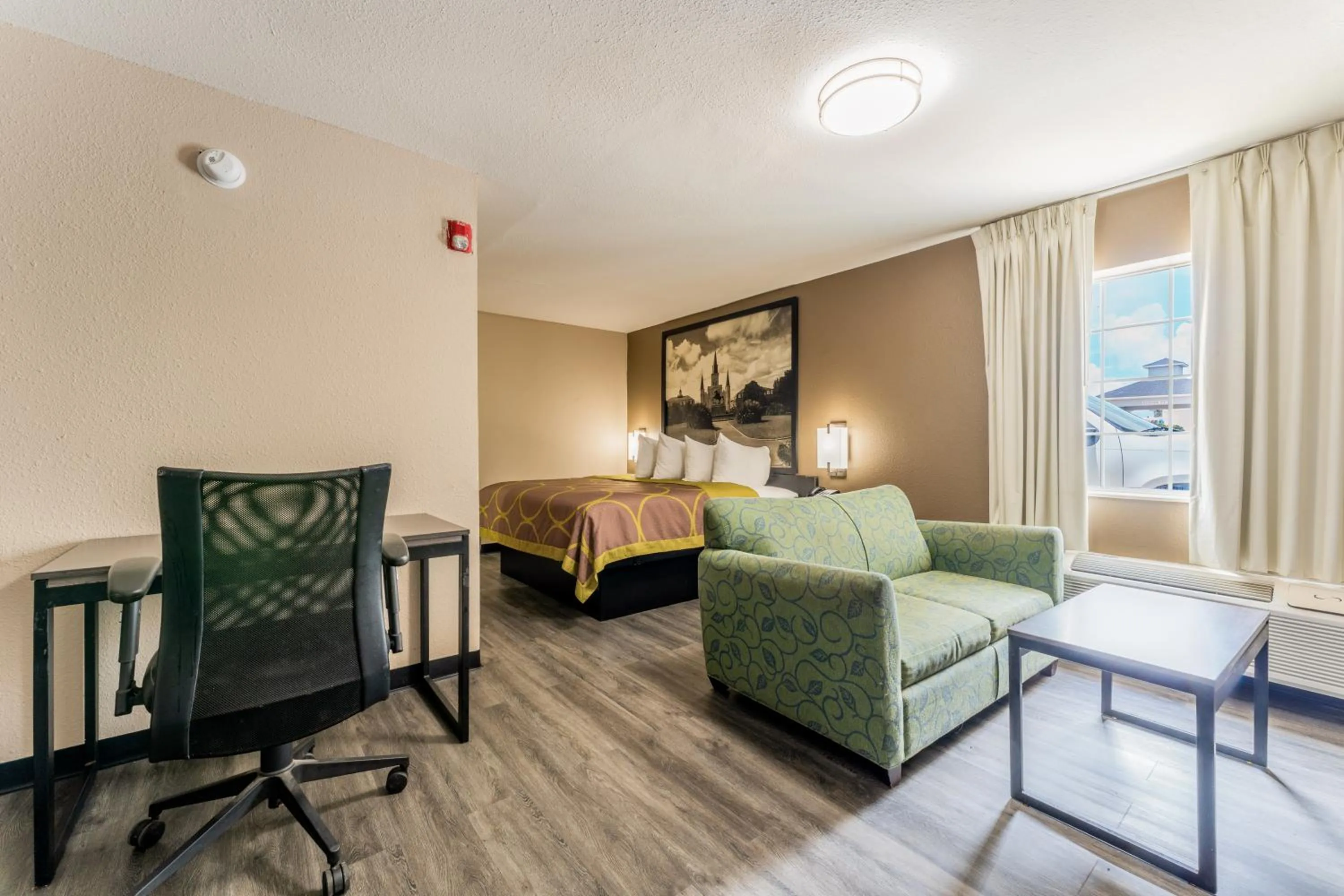 Living room, Bed in Super 8 by Wyndham Lake Charles Northeast