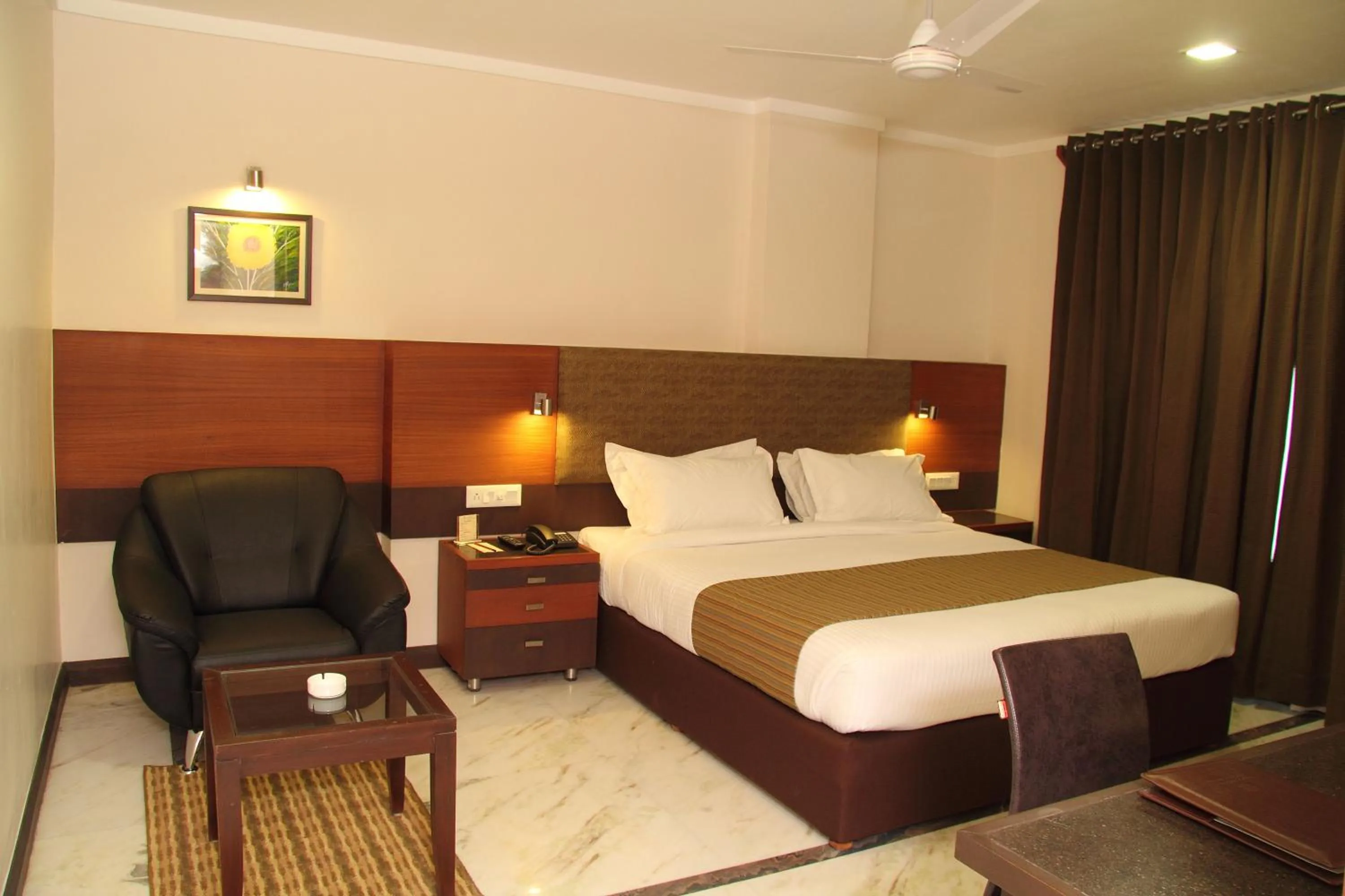 Bed in Amantra Comfort Hotel