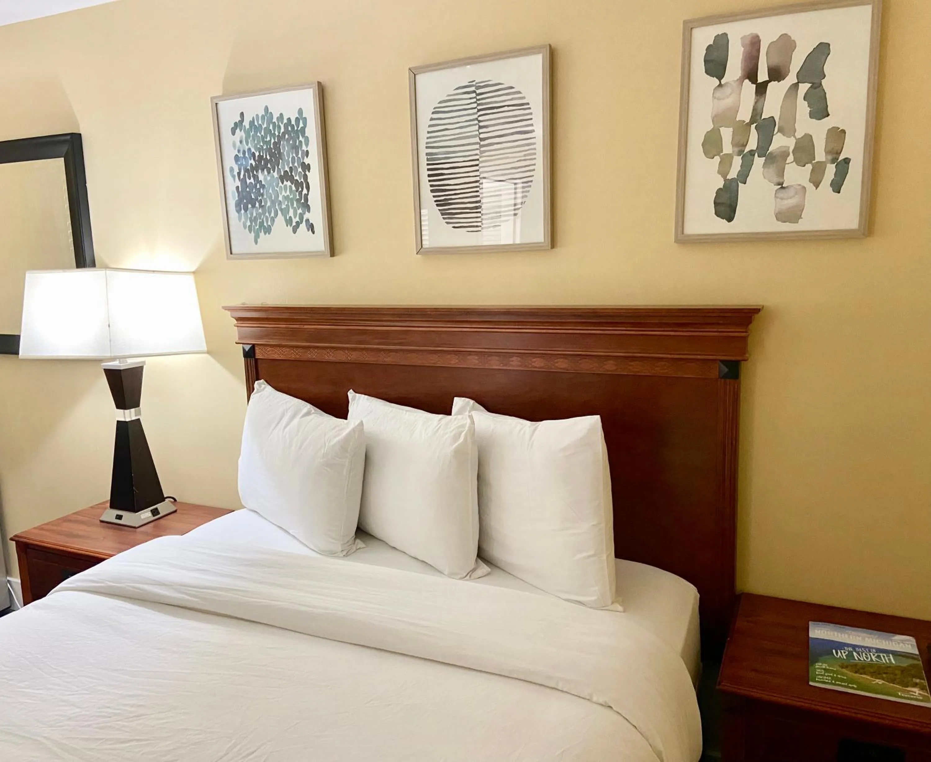 Bed in Elk Rapids Lakeshore Inn