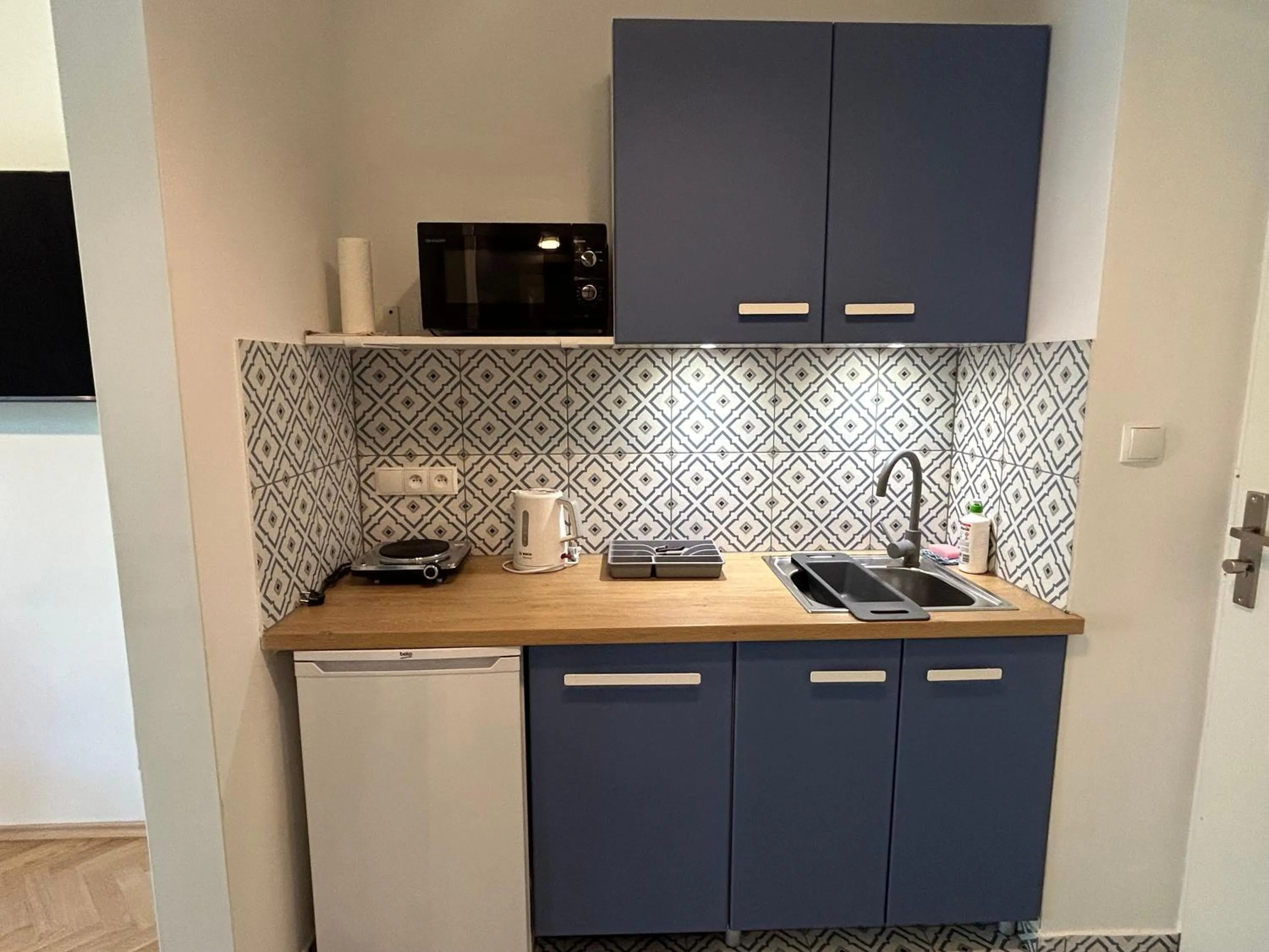 Kitchen or kitchenette in Cybulskiego Guest Rooms