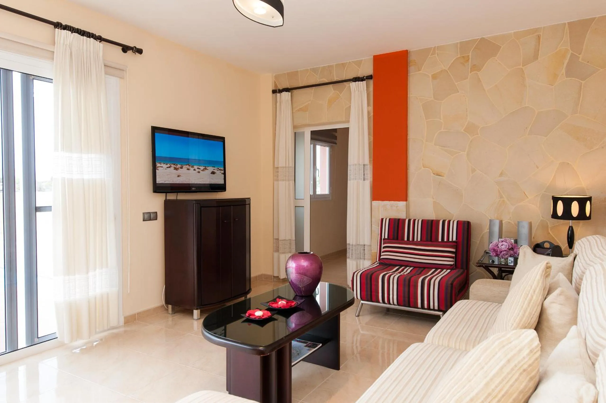 Communal lounge/ TV room in Villa Los Azules with pool and jacuzzi