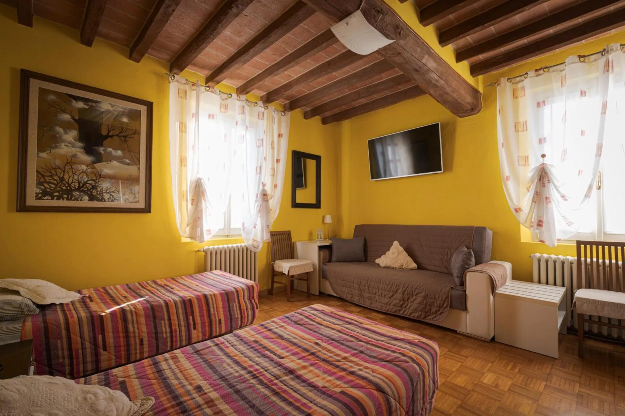 Seating area, Bed in La Fossetta B&B