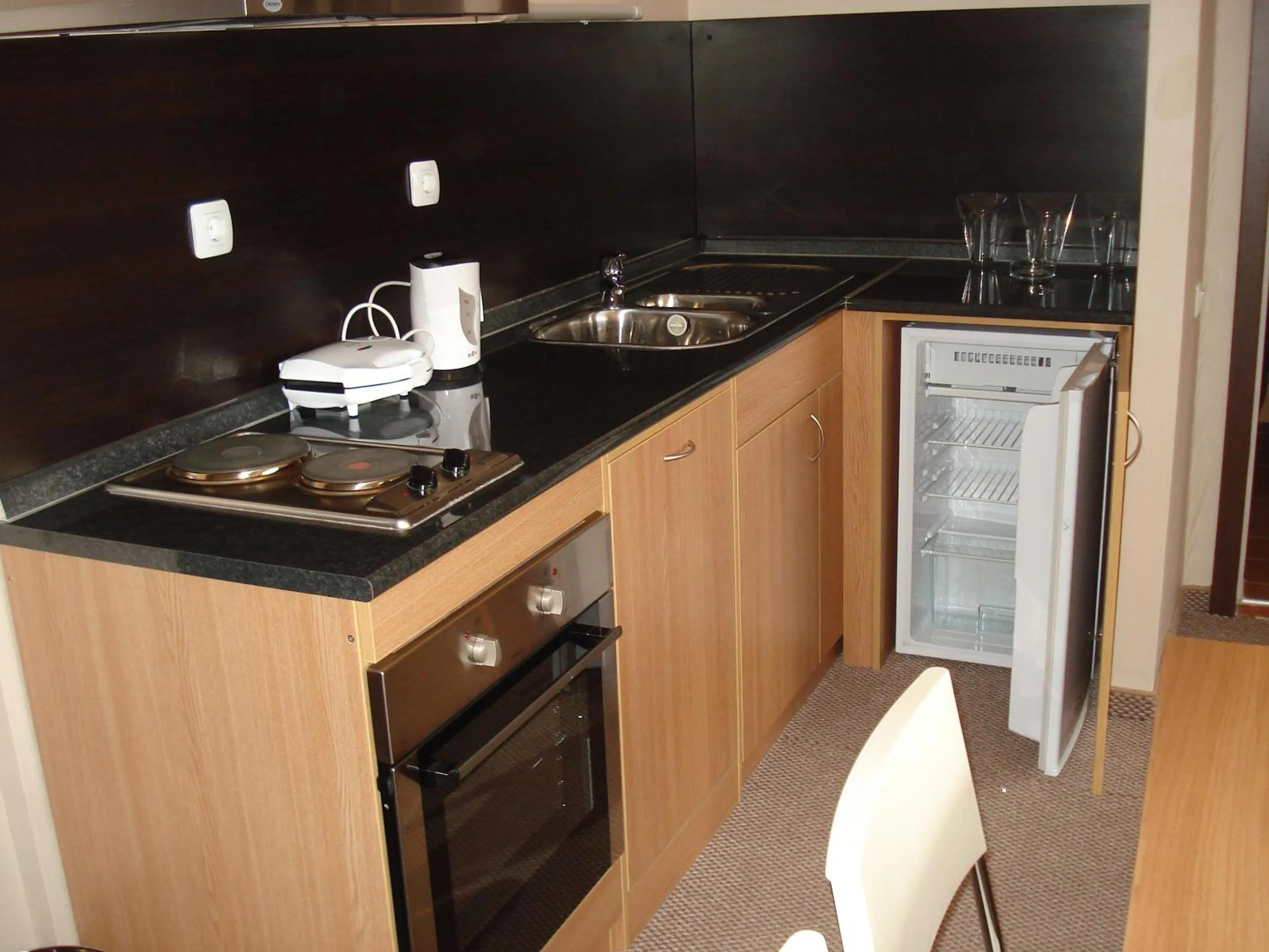 Kitchen or kitchenette in Snezhanka Apartments TMF