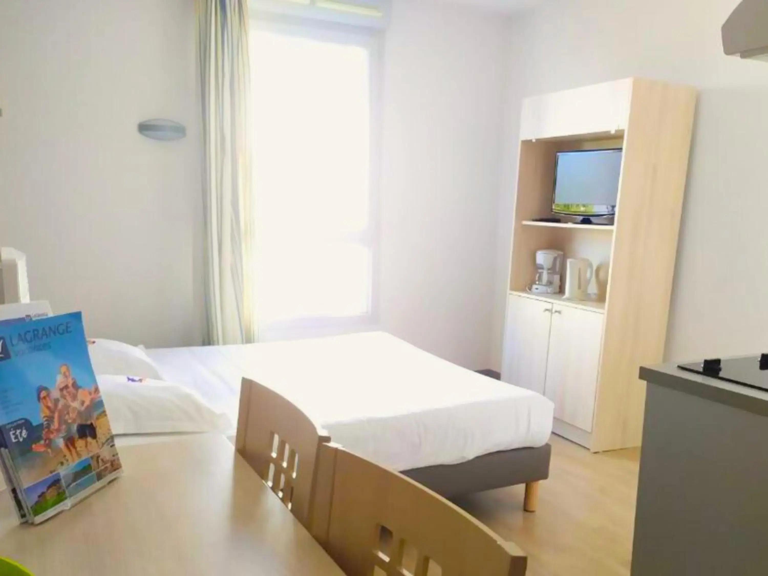 Bedroom, Bed in Lagrange Apart'Hotel l’Escale Marine Bedroom, Bed in Lagrange Apart'Hotel l’Escale Marine