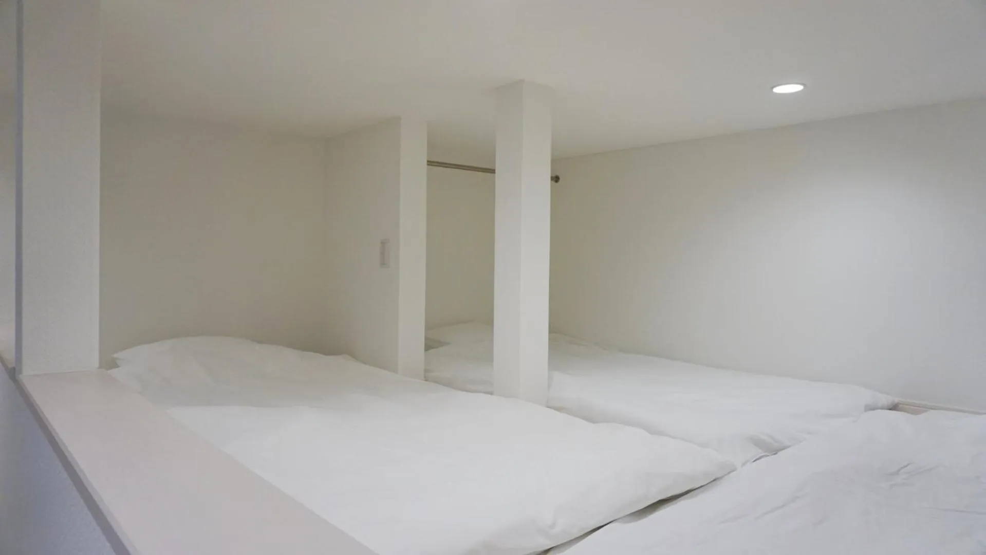 Bed in TRIP POD TAKASAGO A