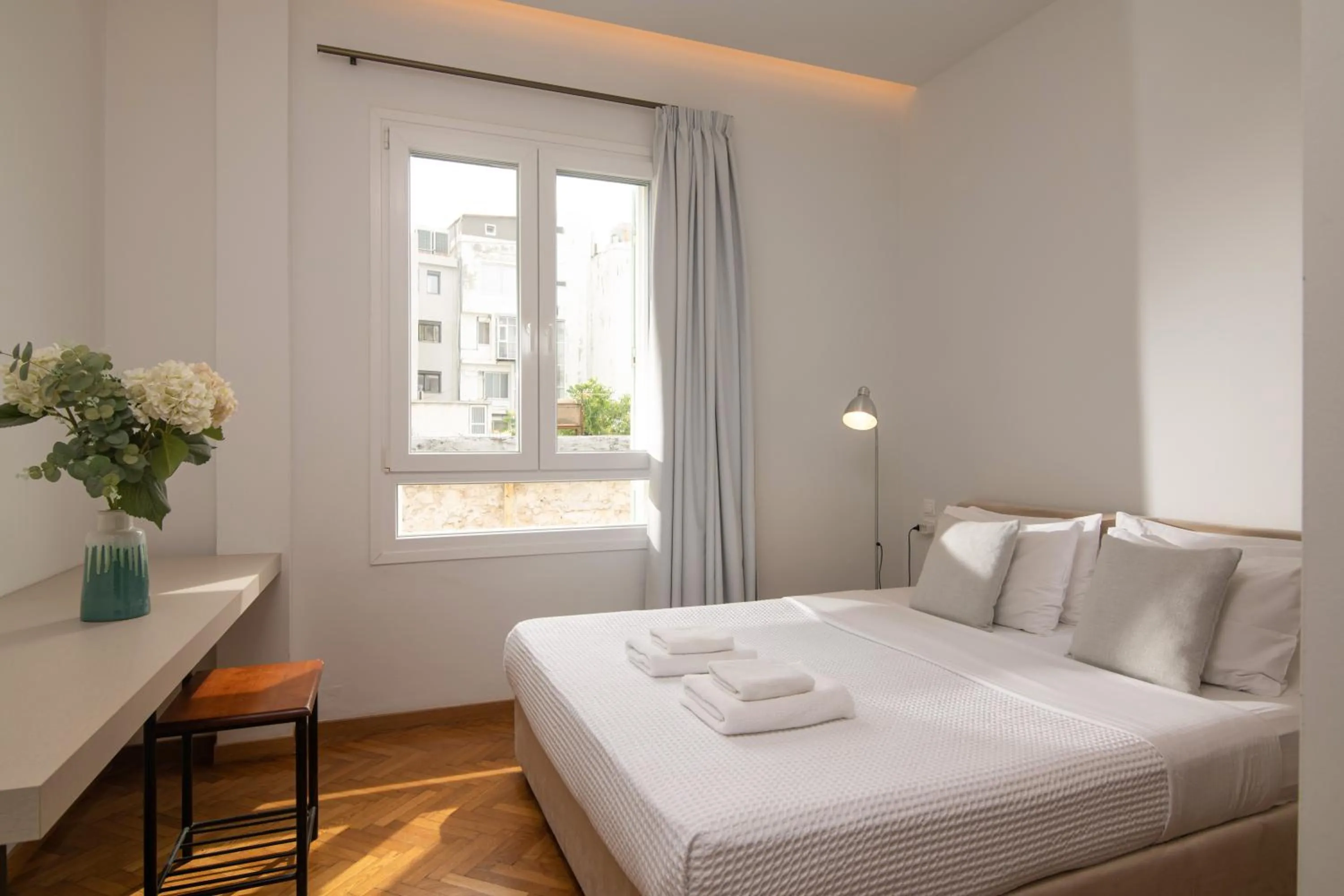 Bed in The Central Boutique Apartments