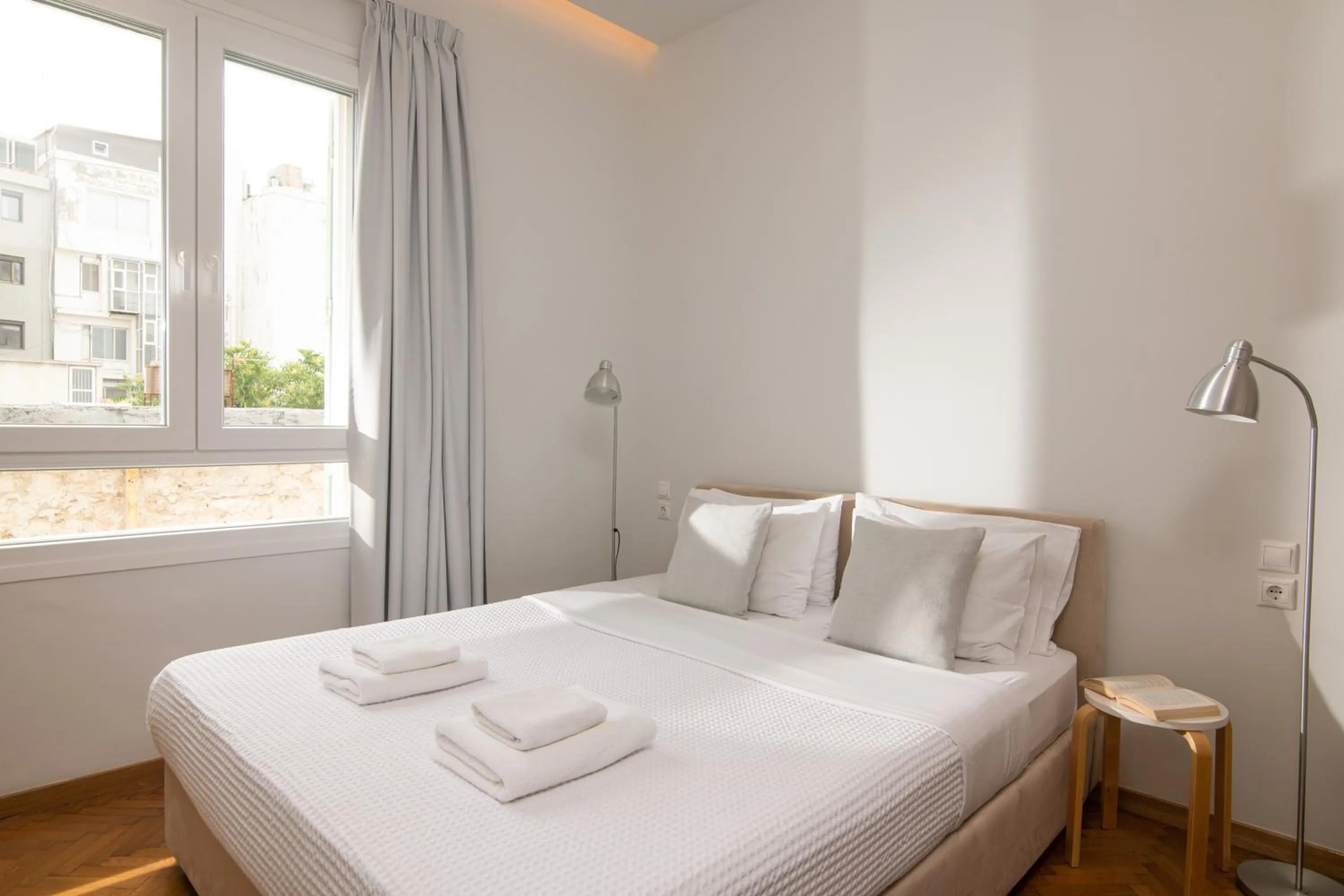 Bed in The Central Boutique Apartments