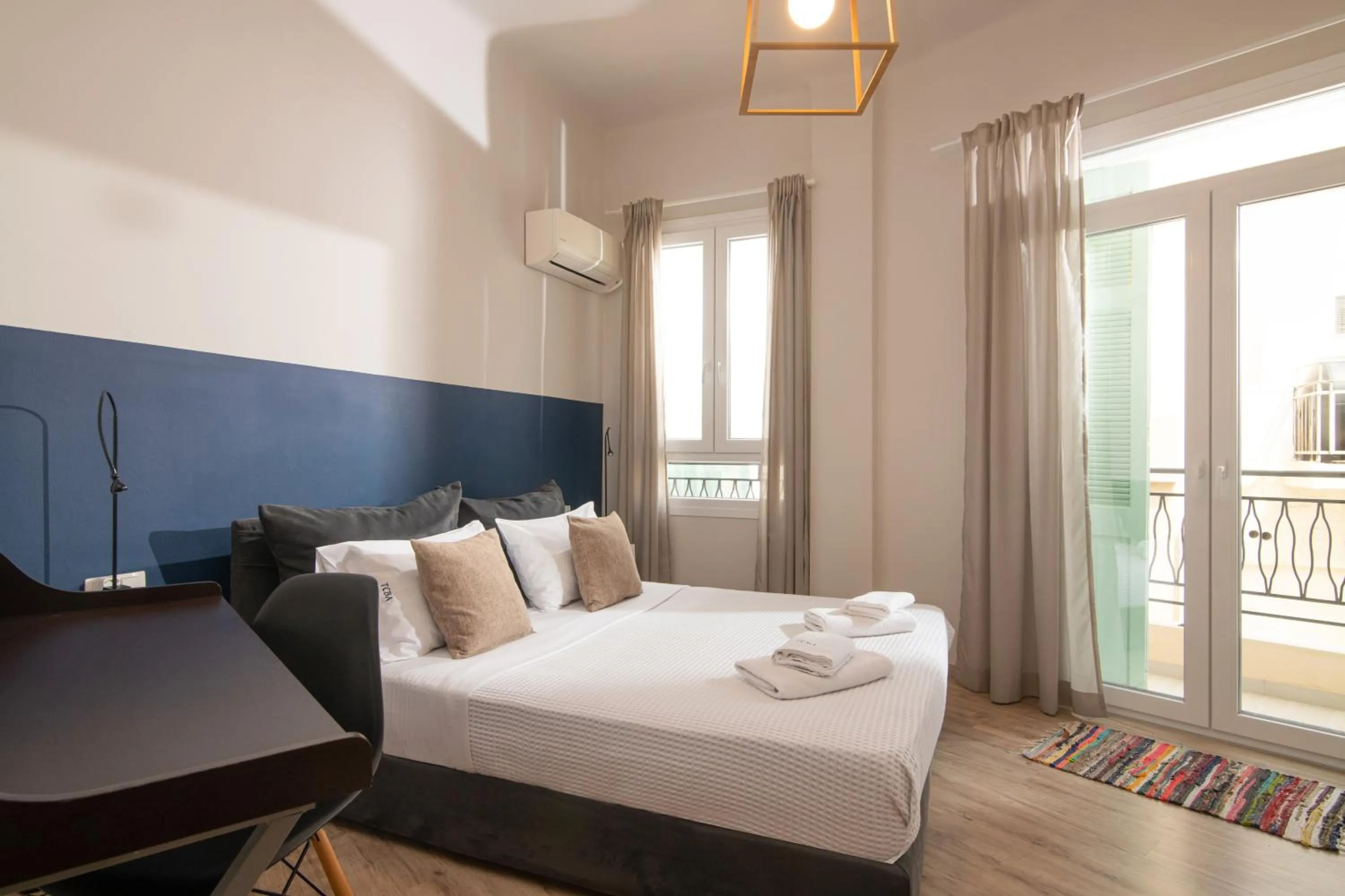 Bed in The Central Boutique Apartments