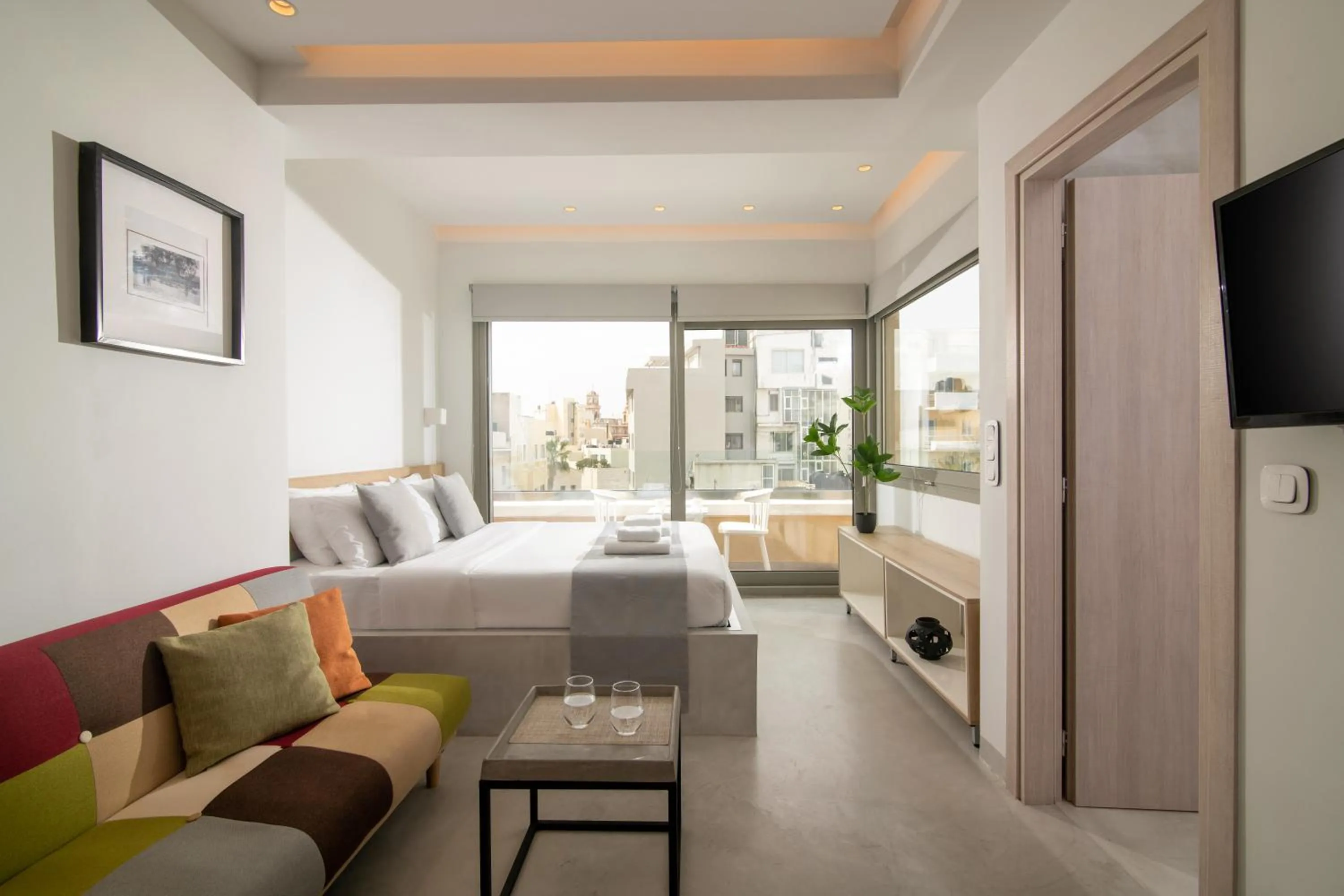 Bed in The Central Boutique Apartments