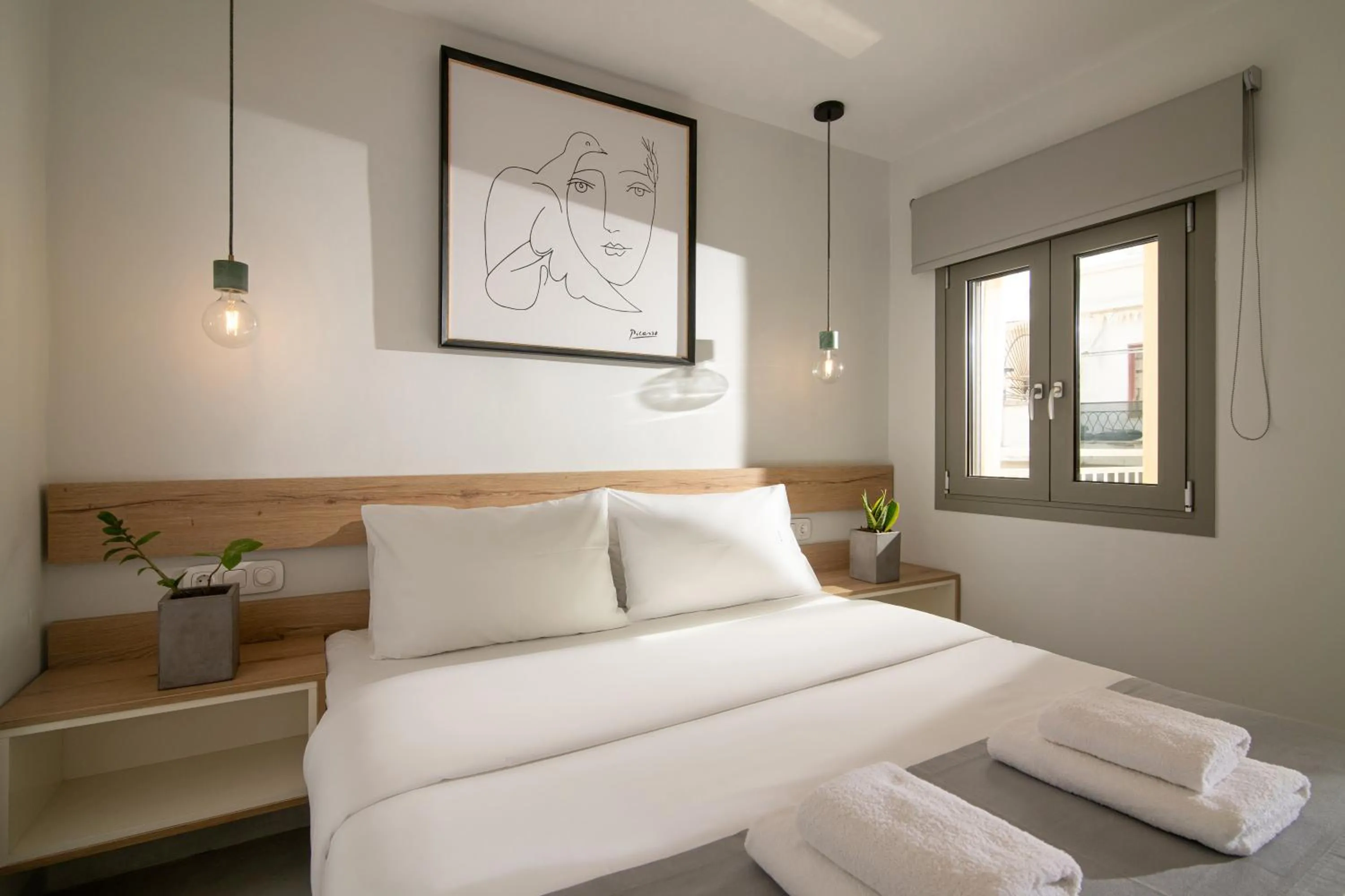 Bed in The Central Boutique Apartments