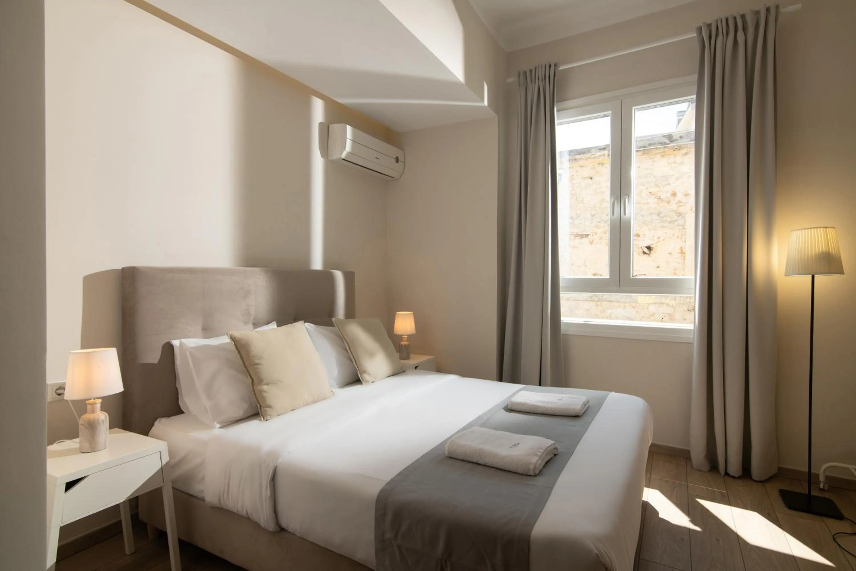 Bed in The Central Boutique Apartments