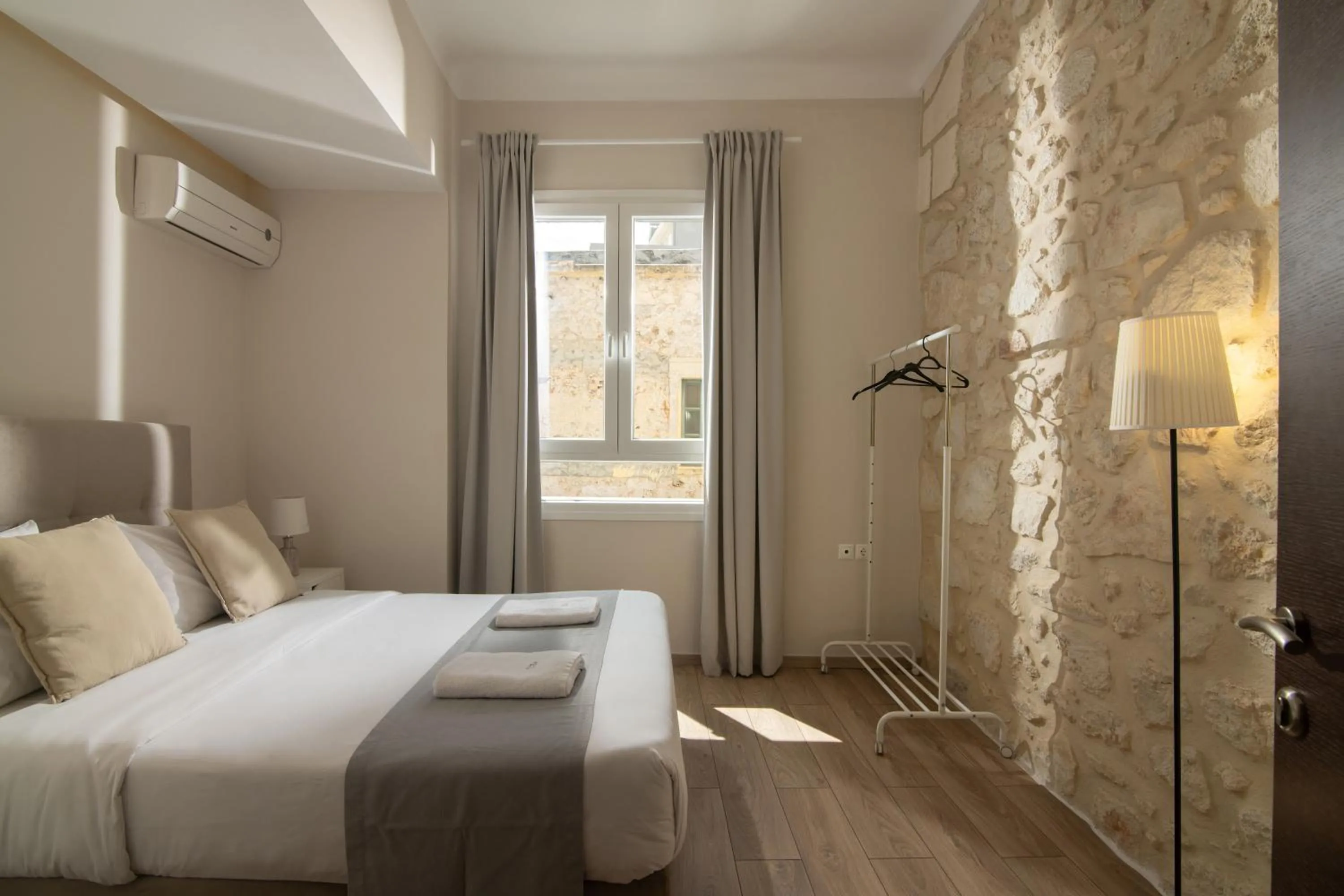 Bed in The Central Boutique Apartments
