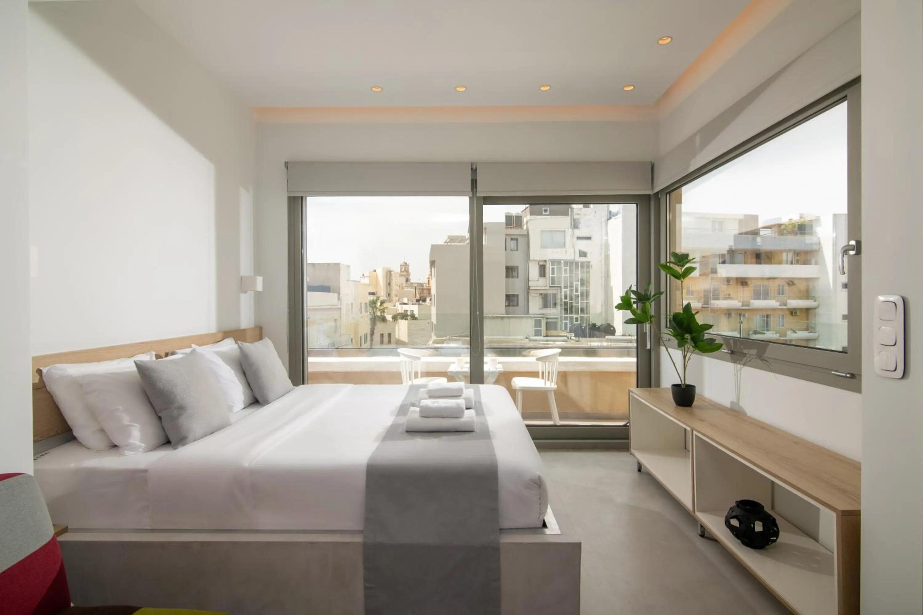 Bed in The Central Boutique Apartments