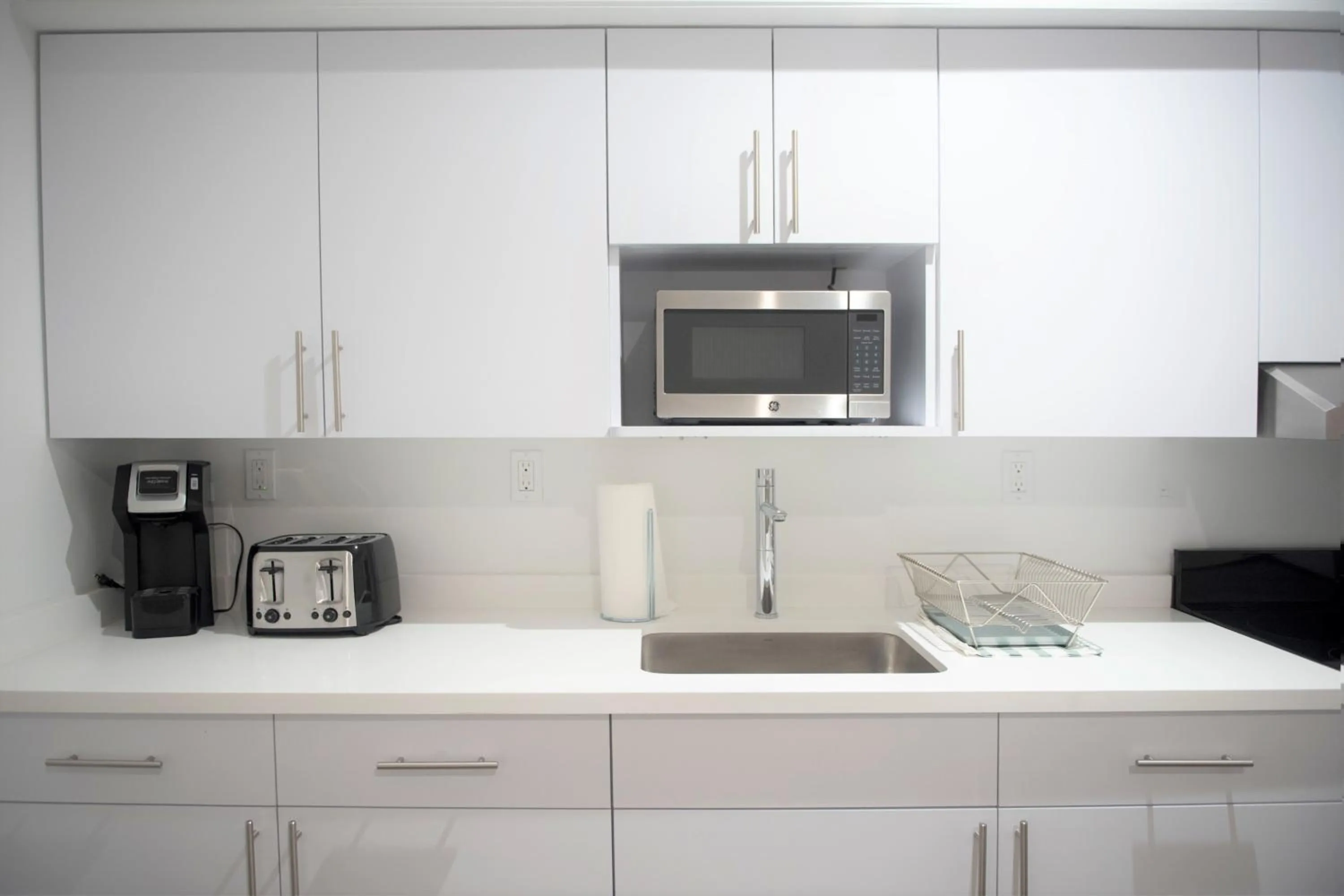 Kitchen/Kitchenette in 12th & Ocean Suites by LuxUrban