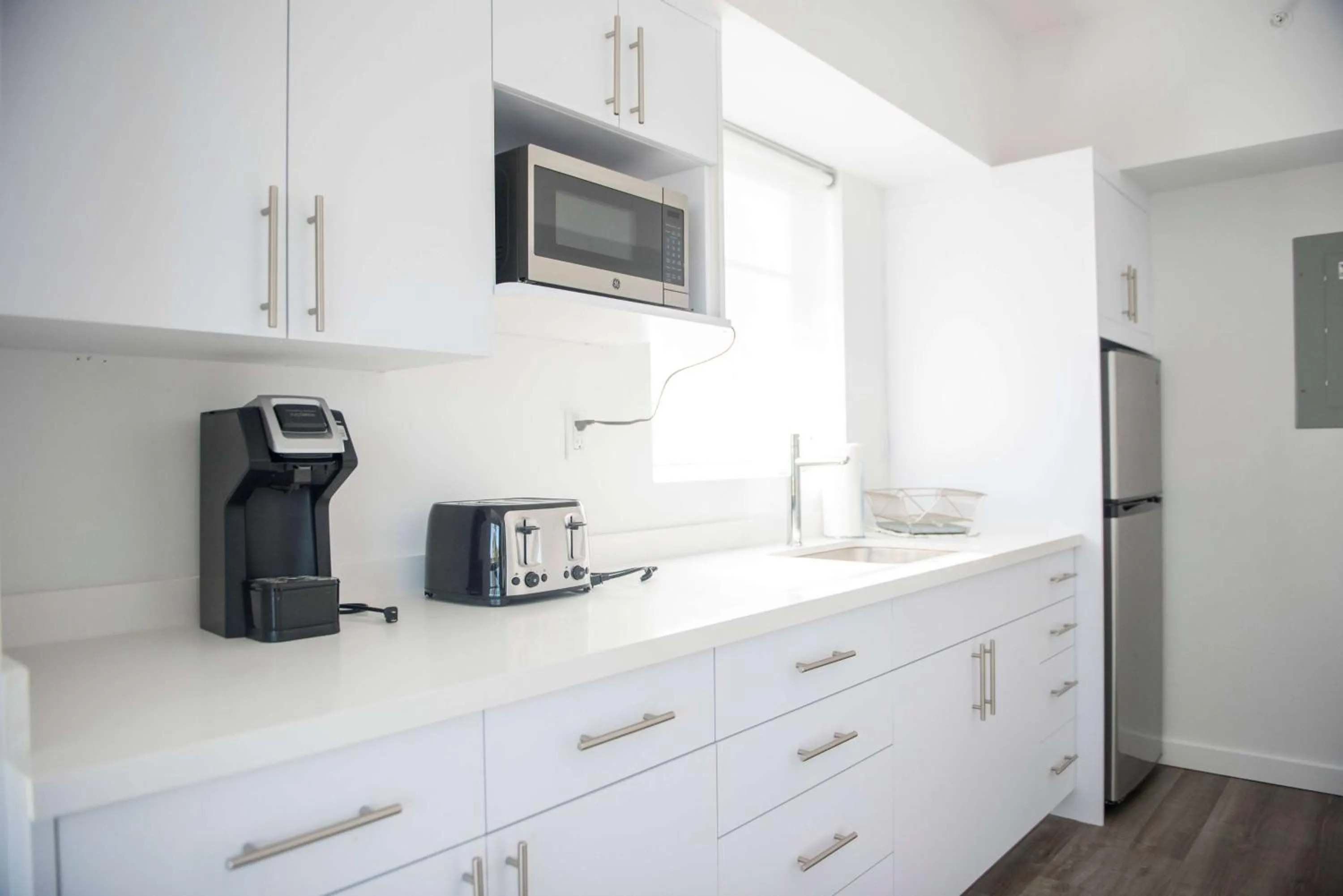 Photo of the whole room, Kitchen/Kitchenette in 12th & Ocean Suites by LuxUrban