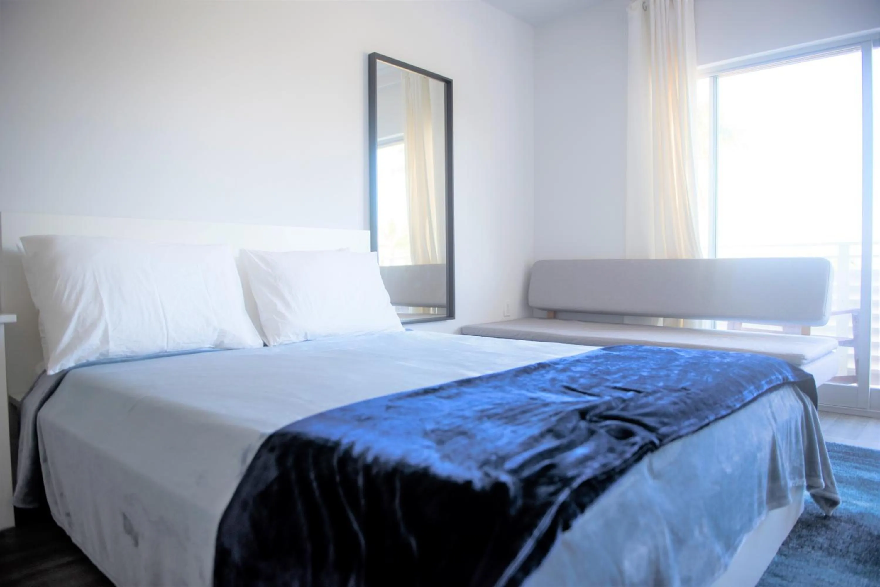 Bedroom in 12th & Ocean Suites by LuxUrban