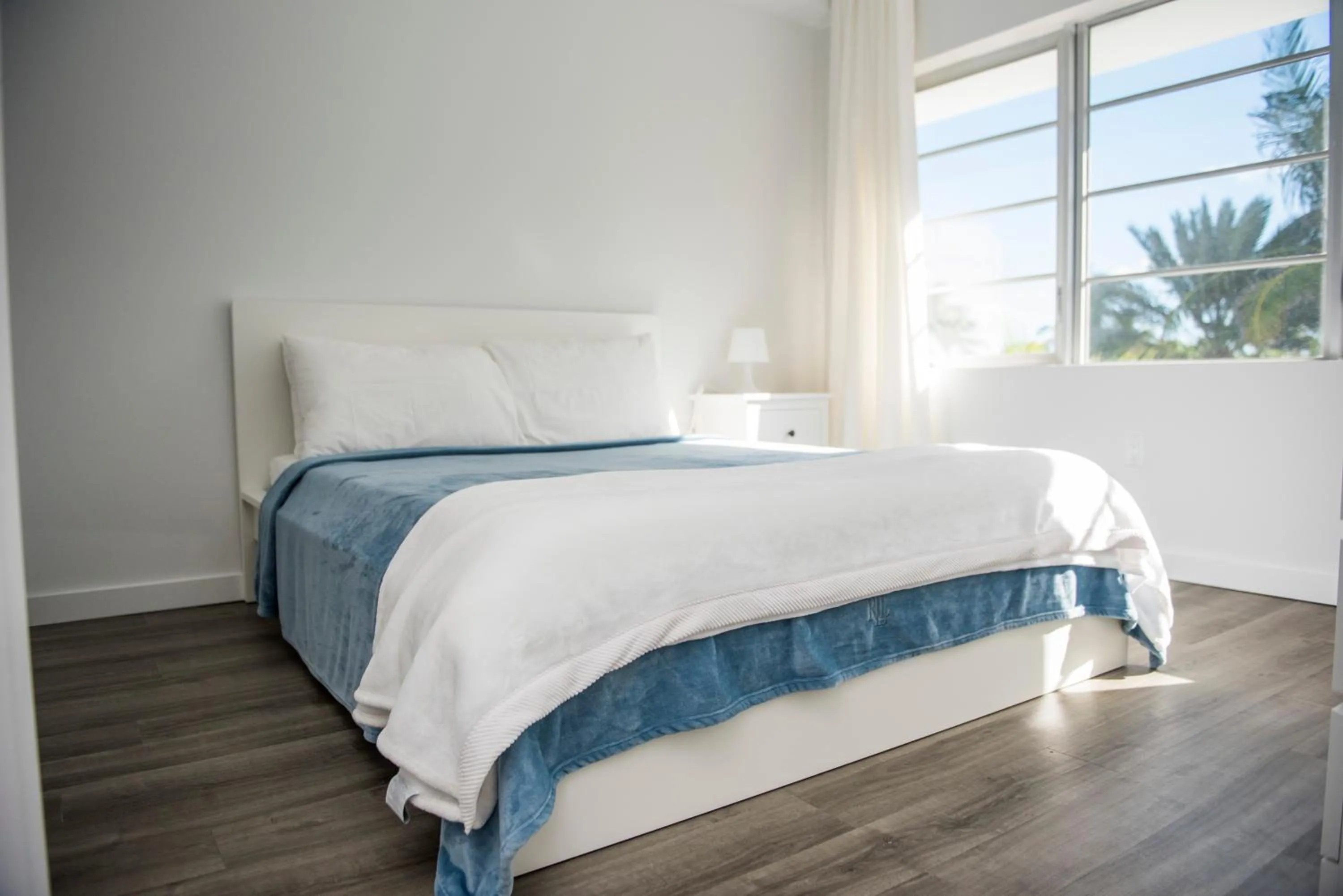 Bed in 12th & Ocean Suites by LuxUrban