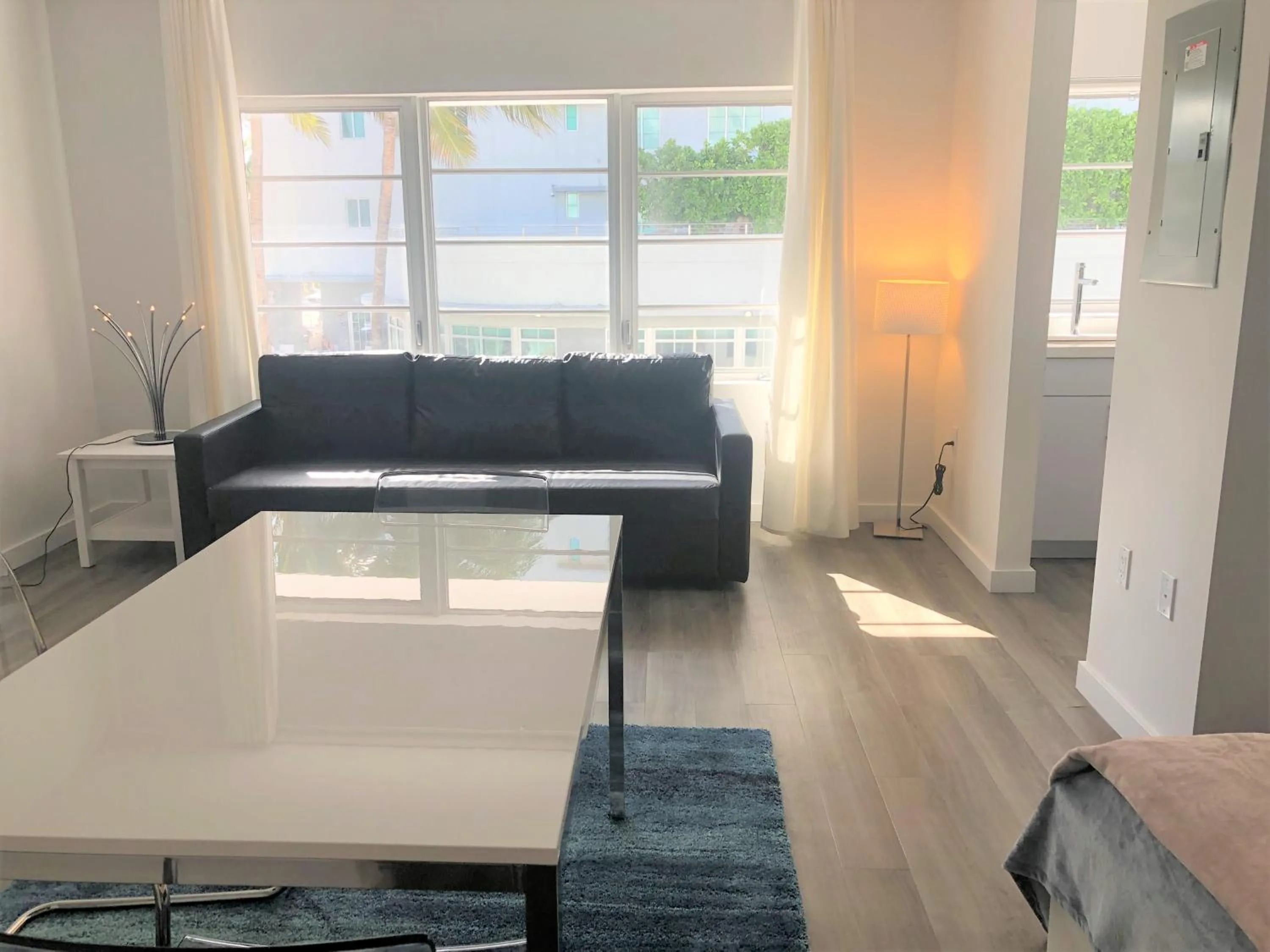 Seating Area in 12th & Ocean Suites by LuxUrban