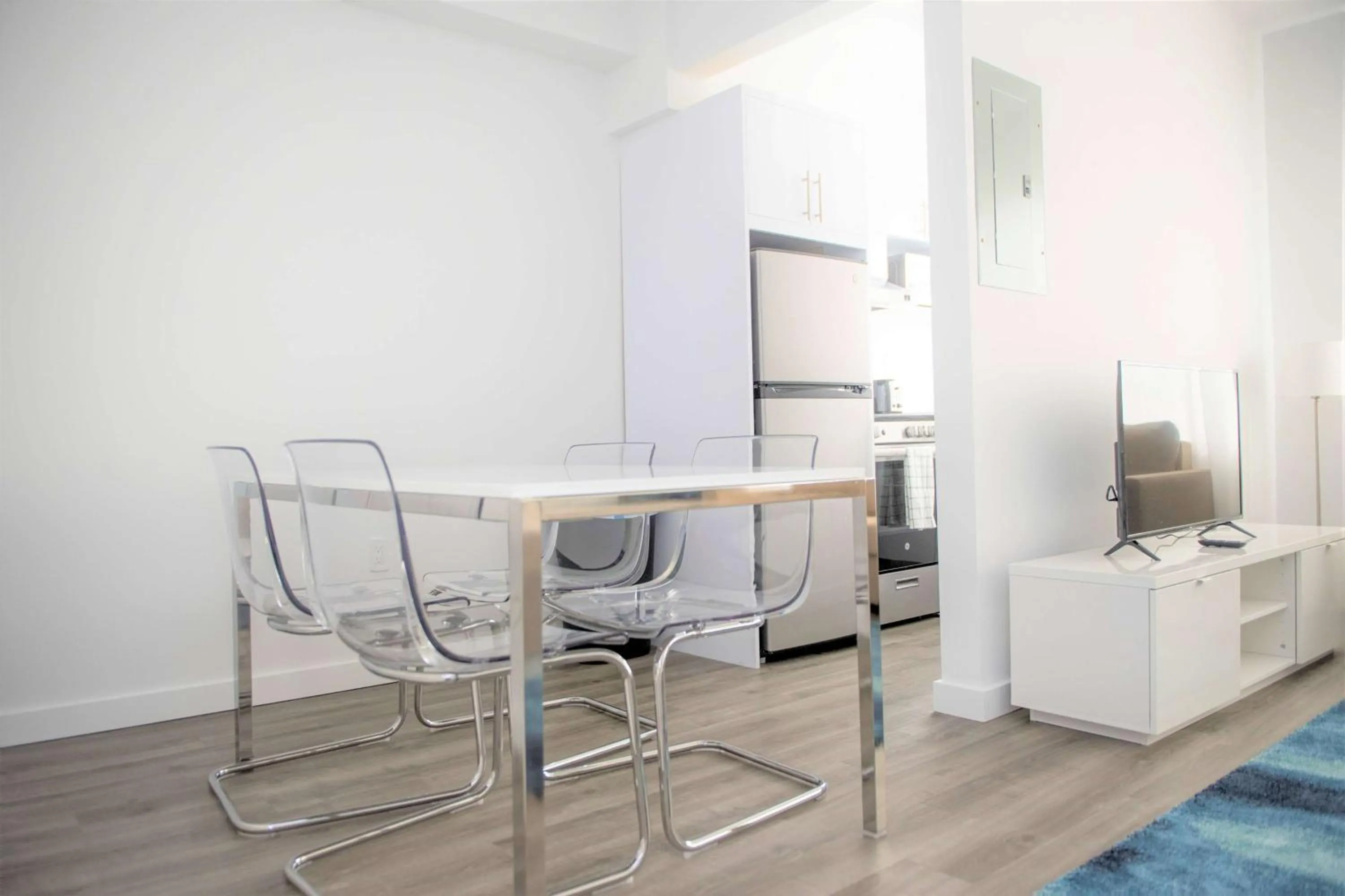 Photo of the whole room, Dining Area in 12th & Ocean Suites by LuxUrban