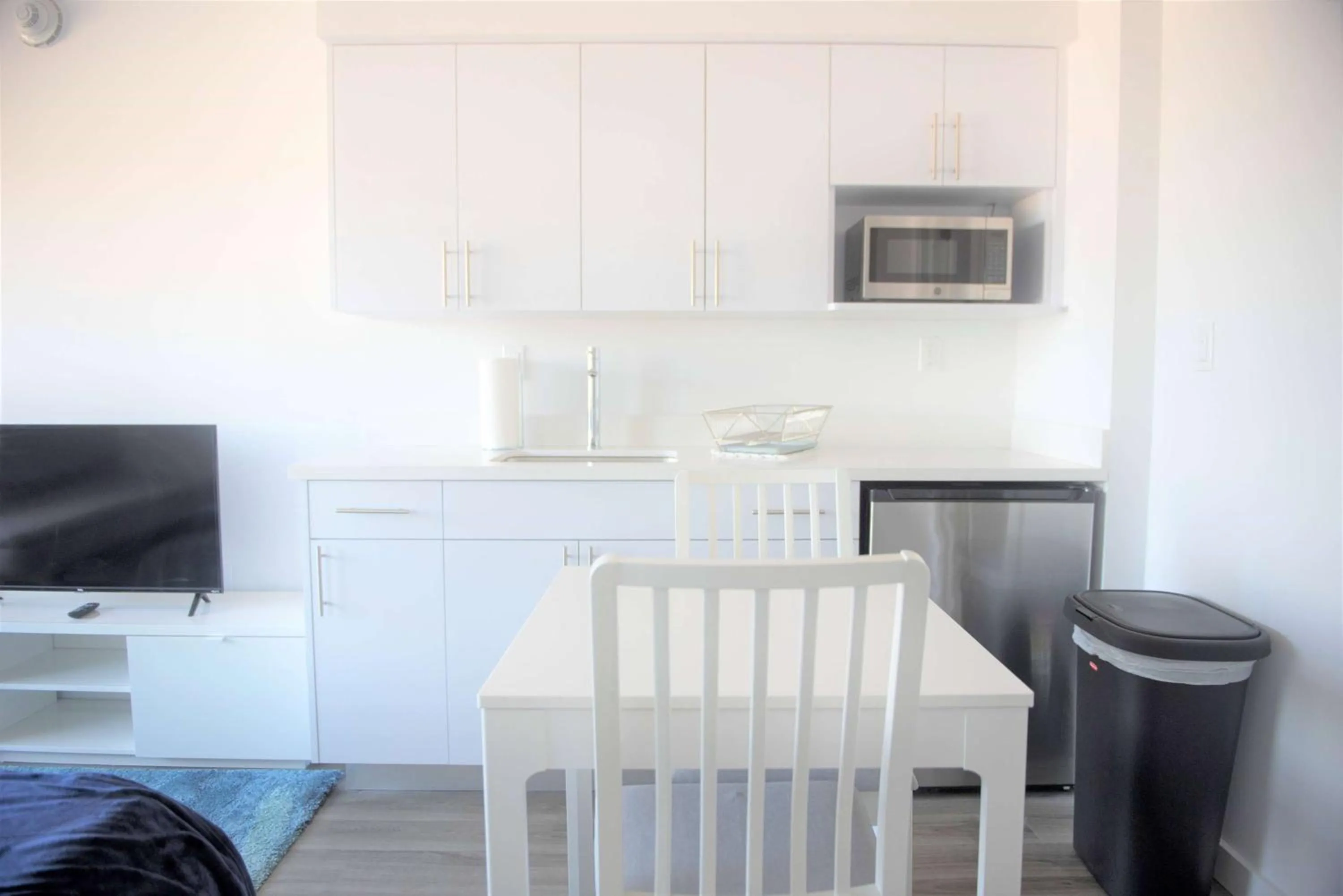 Photo of the whole room, Dining Area in 12th & Ocean Suites by LuxUrban