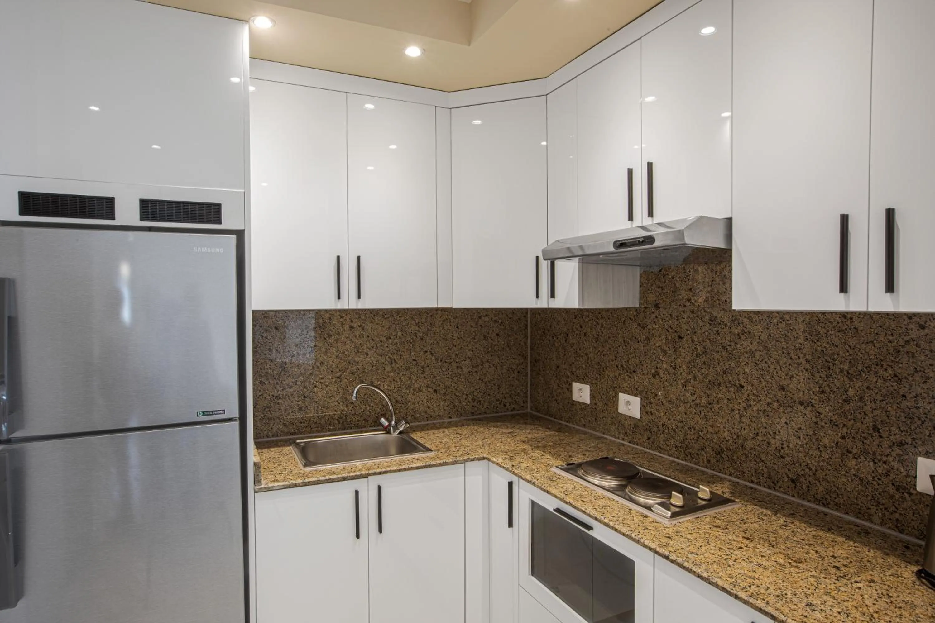 Kitchen or kitchenette in Sky View Suites Hotel