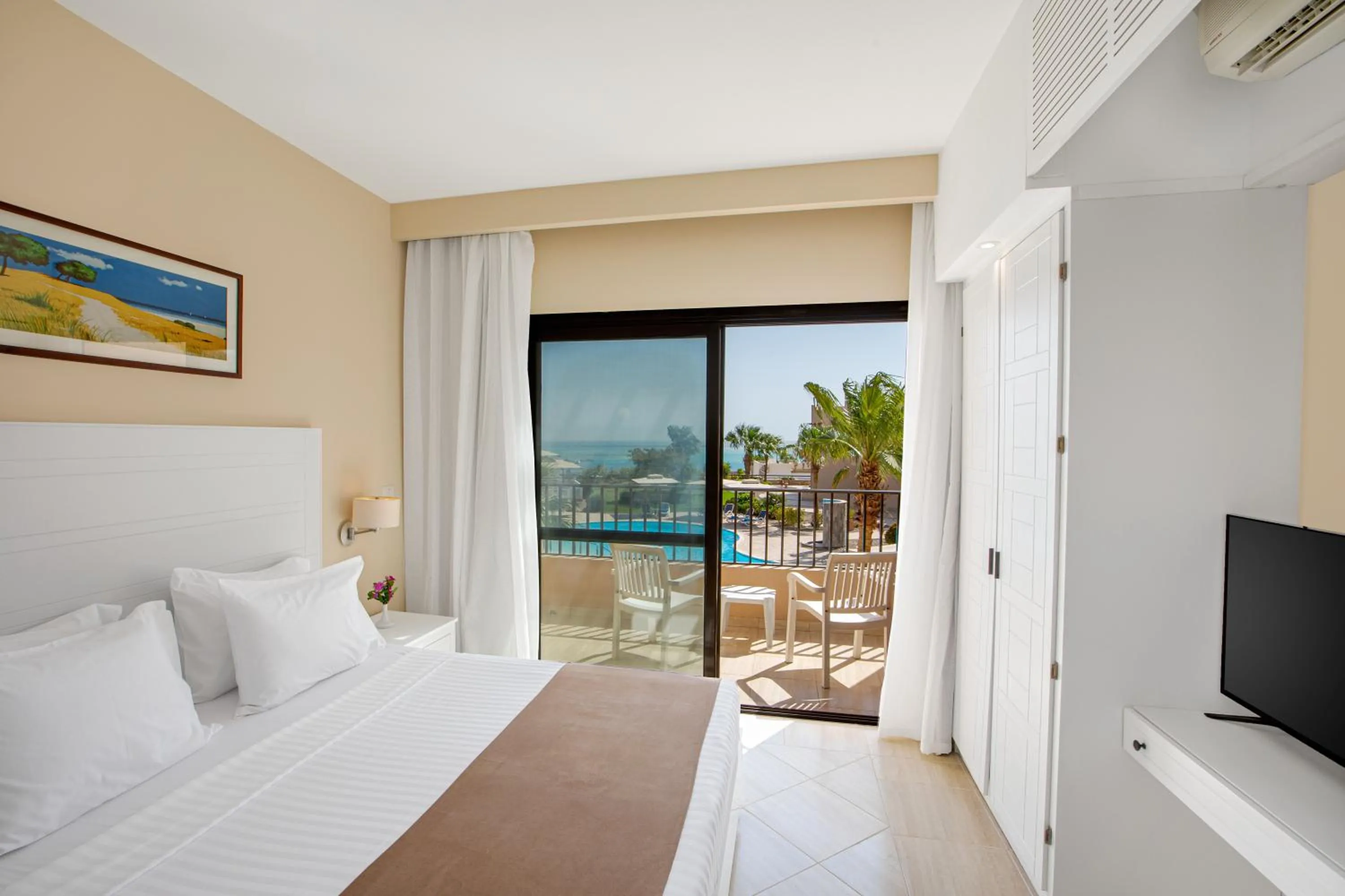 Bed in Sky View Suites Hotel