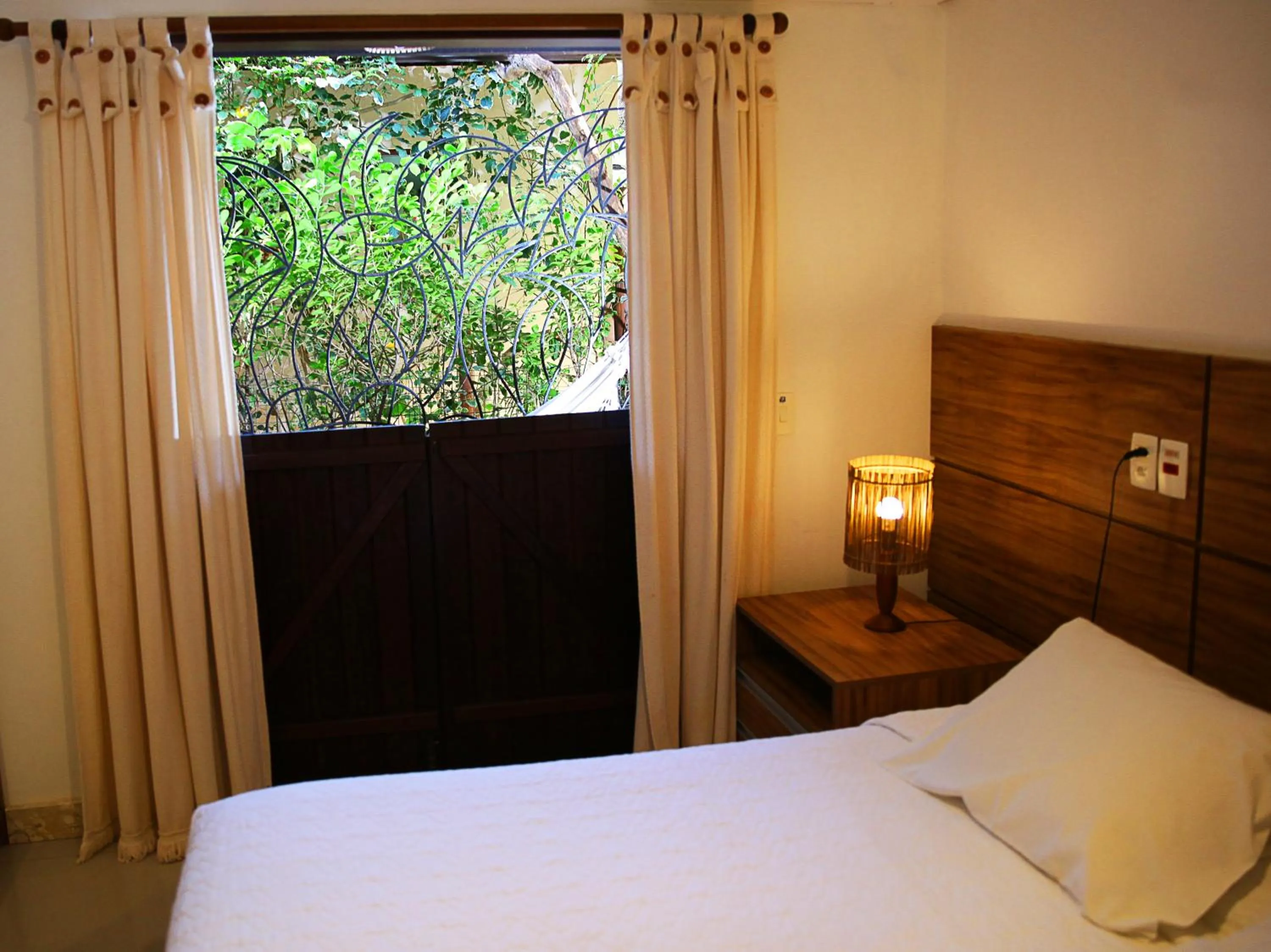 Bed in Pousada Ogum Marinho