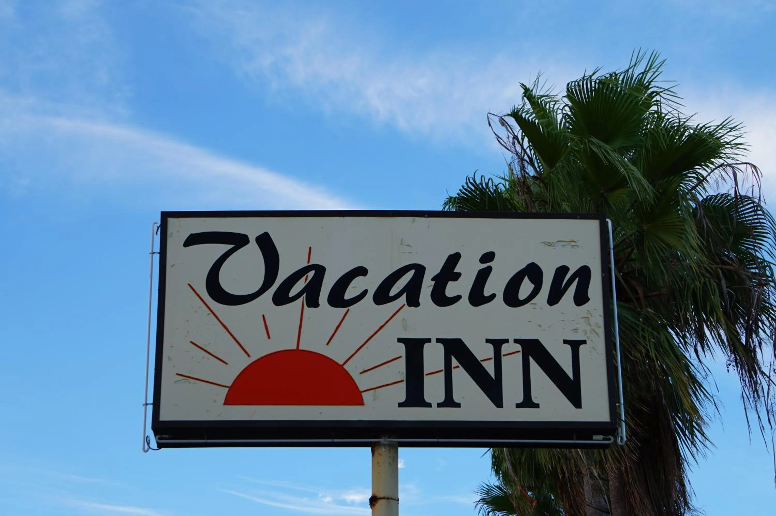 Property logo or sign in Vacation Inn Motel
