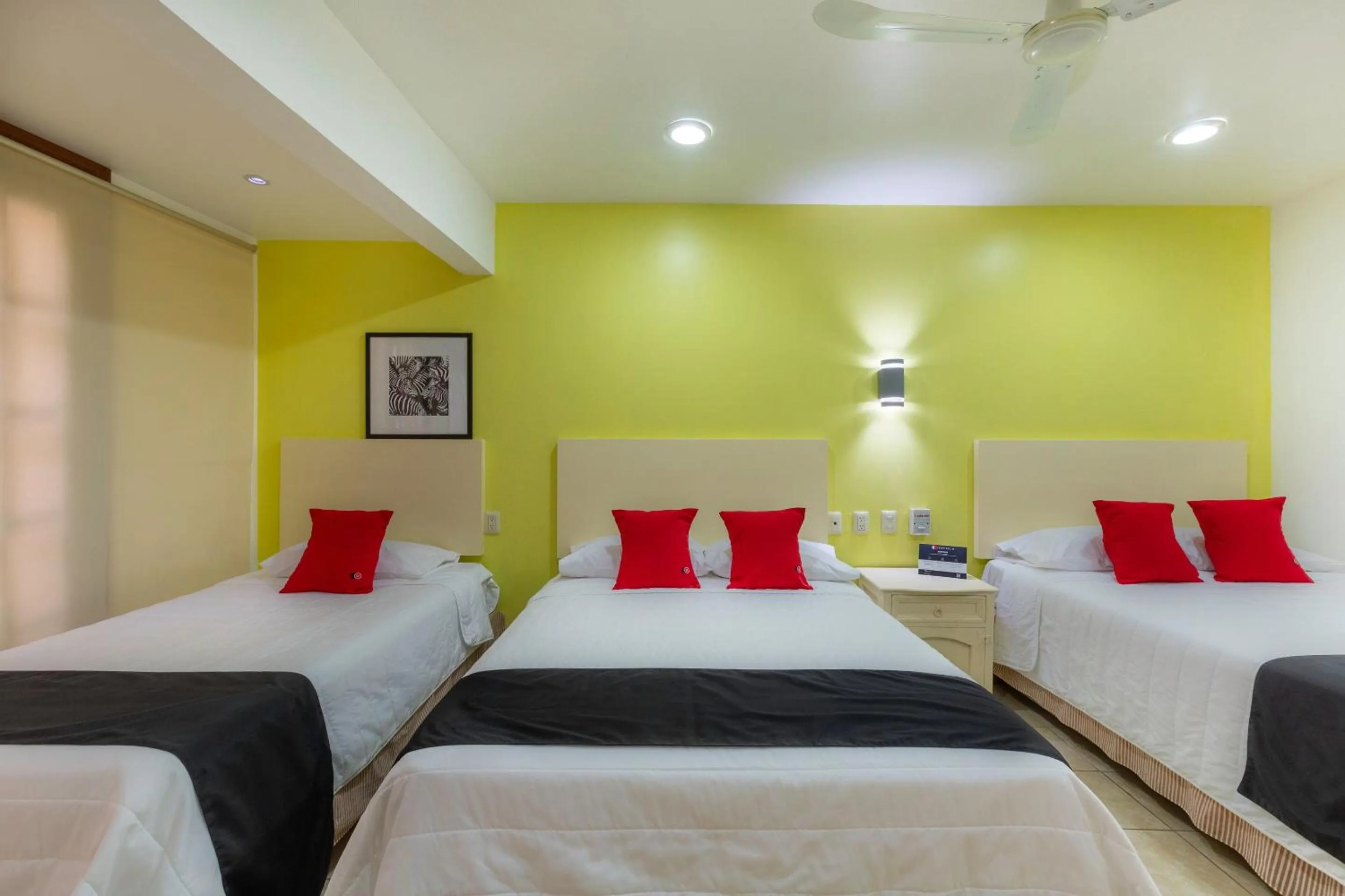 Bedroom in Capital O Oaxaca Guest Hotel