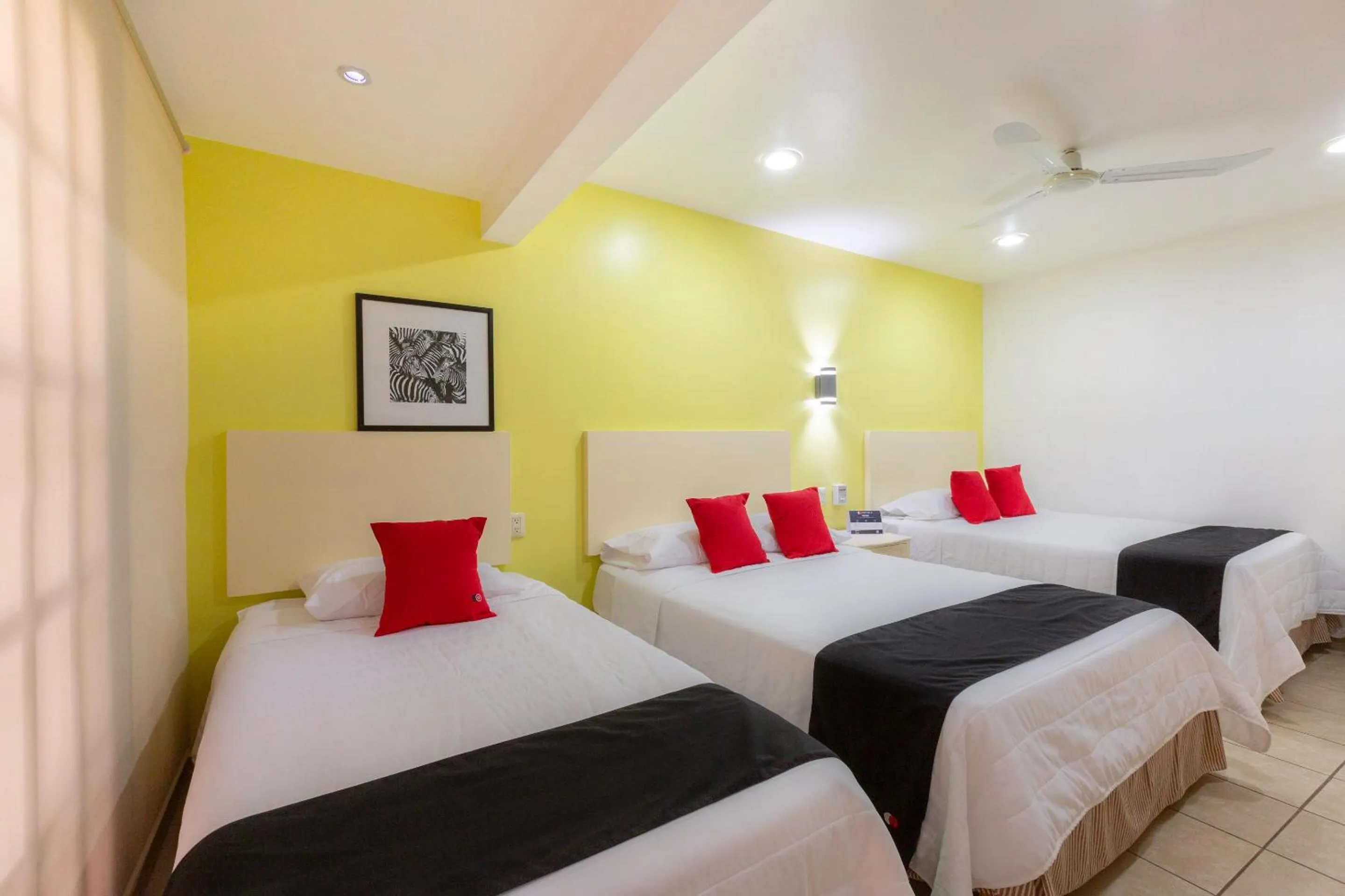 Bedroom in Capital O Oaxaca Guest Hotel