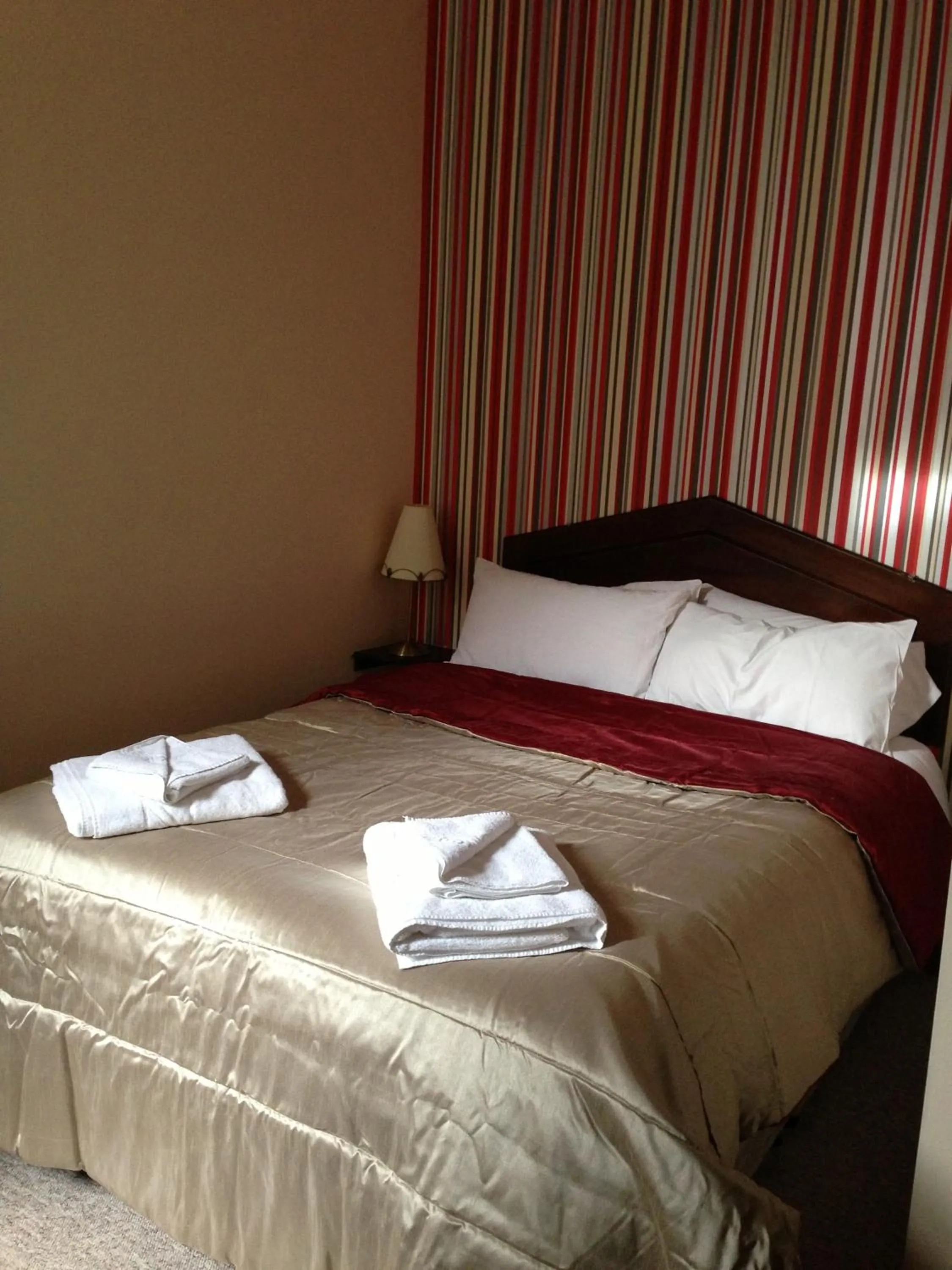 Bed in Ambrose Hotel