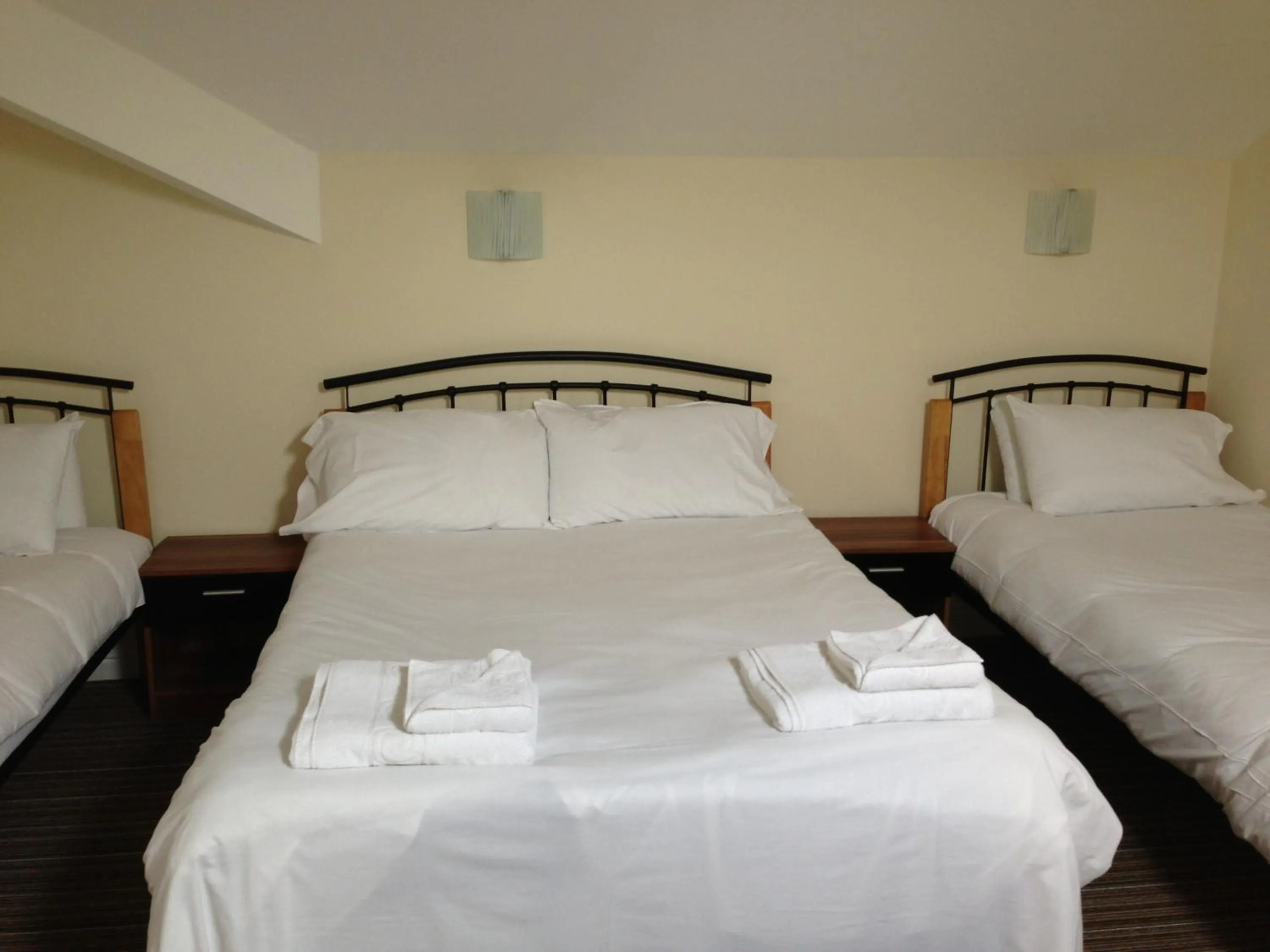 Bed in Ambrose Hotel