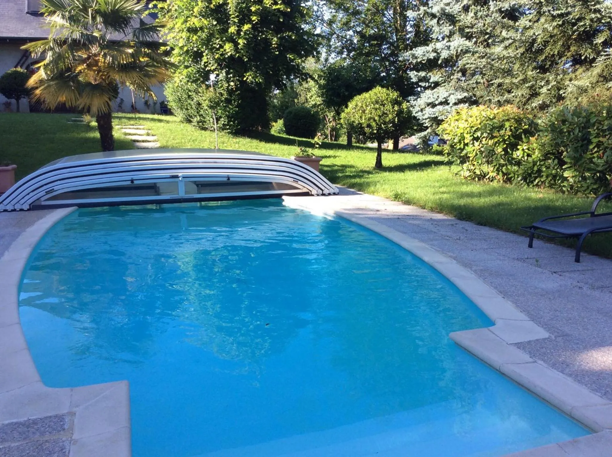 Swimming pool in Demeure d'hôtes Les Irisynes