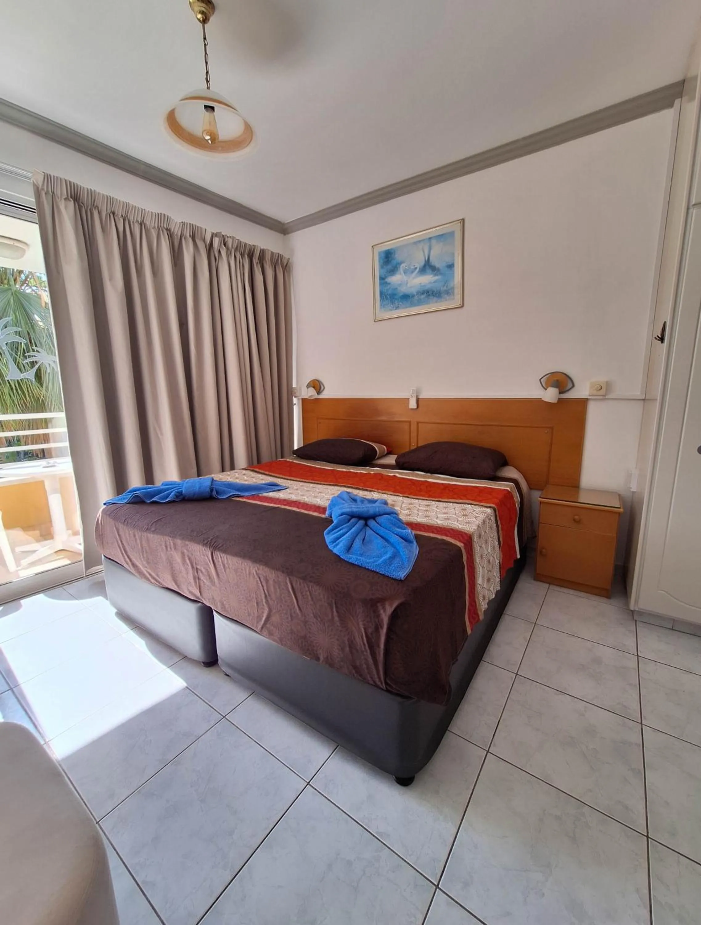 Bed in Apollonia Hotel Apartments