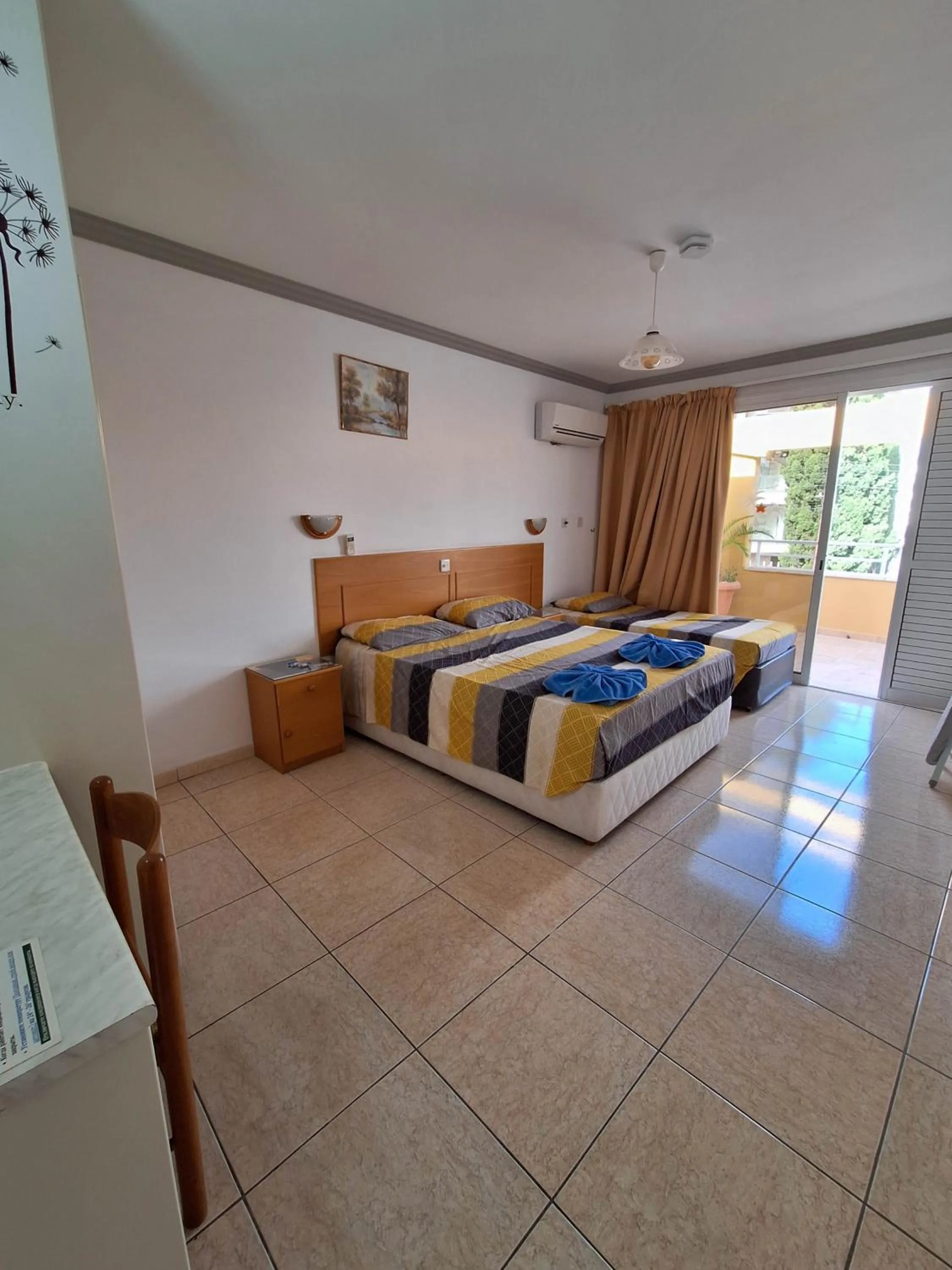 Bed in Apollonia Hotel Apartments