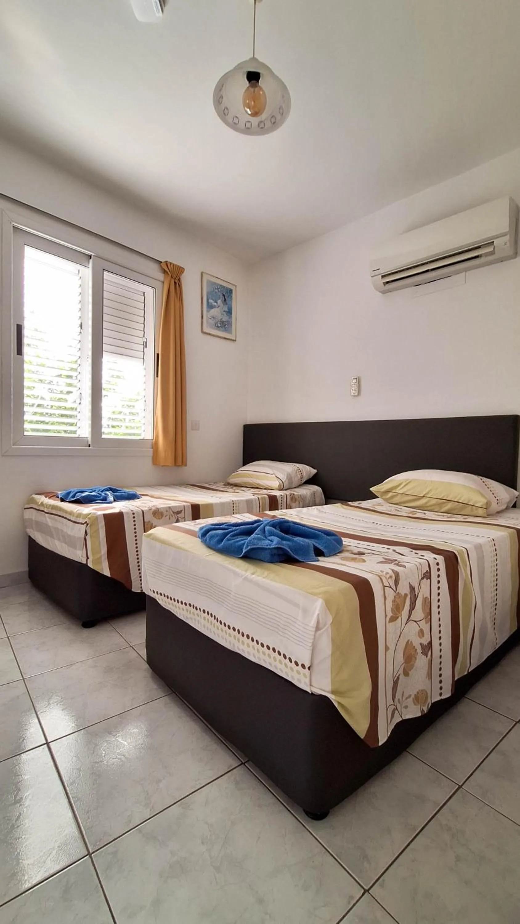 Bed in Apollonia Hotel Apartments