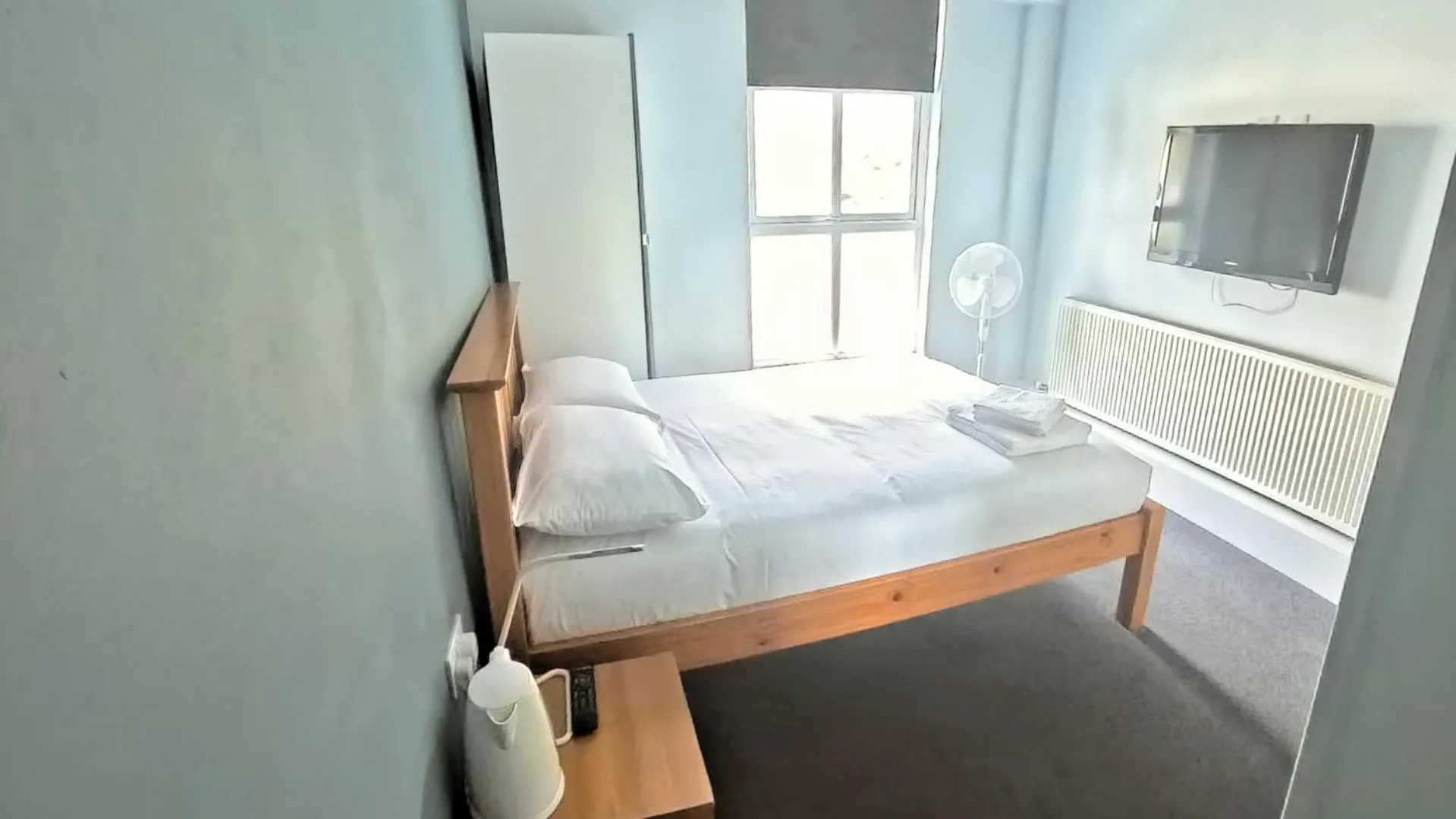 Photo of the whole room, Bed in The Riverside