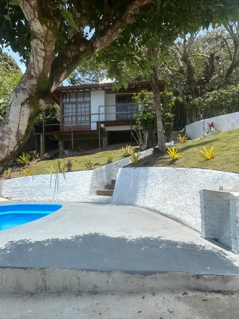 Swimming pool in Pousada Jardim das Bromélias