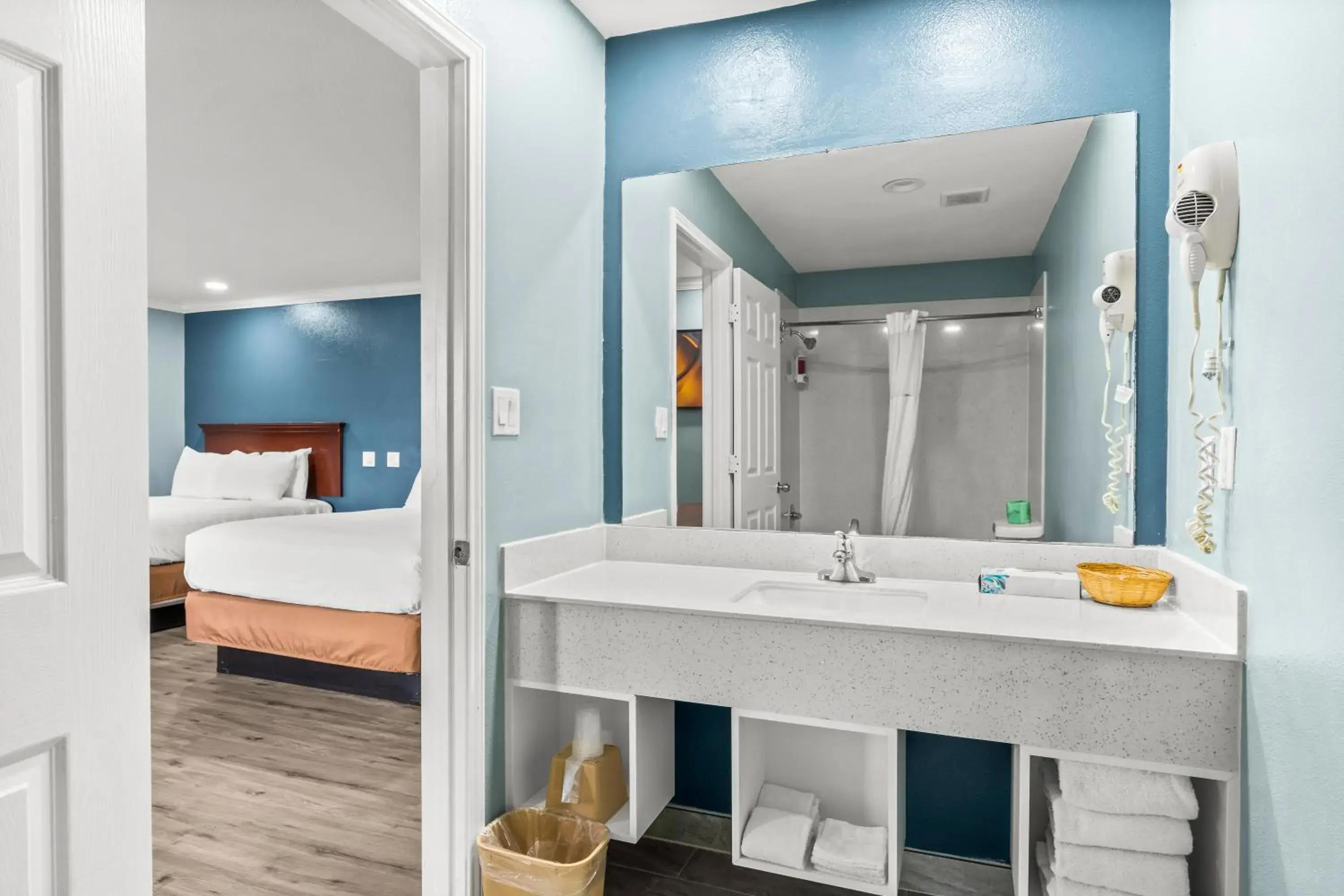 Bed in Executive Inn & Suites Magnolia Bed in Executive Inn & Suites Magnolia