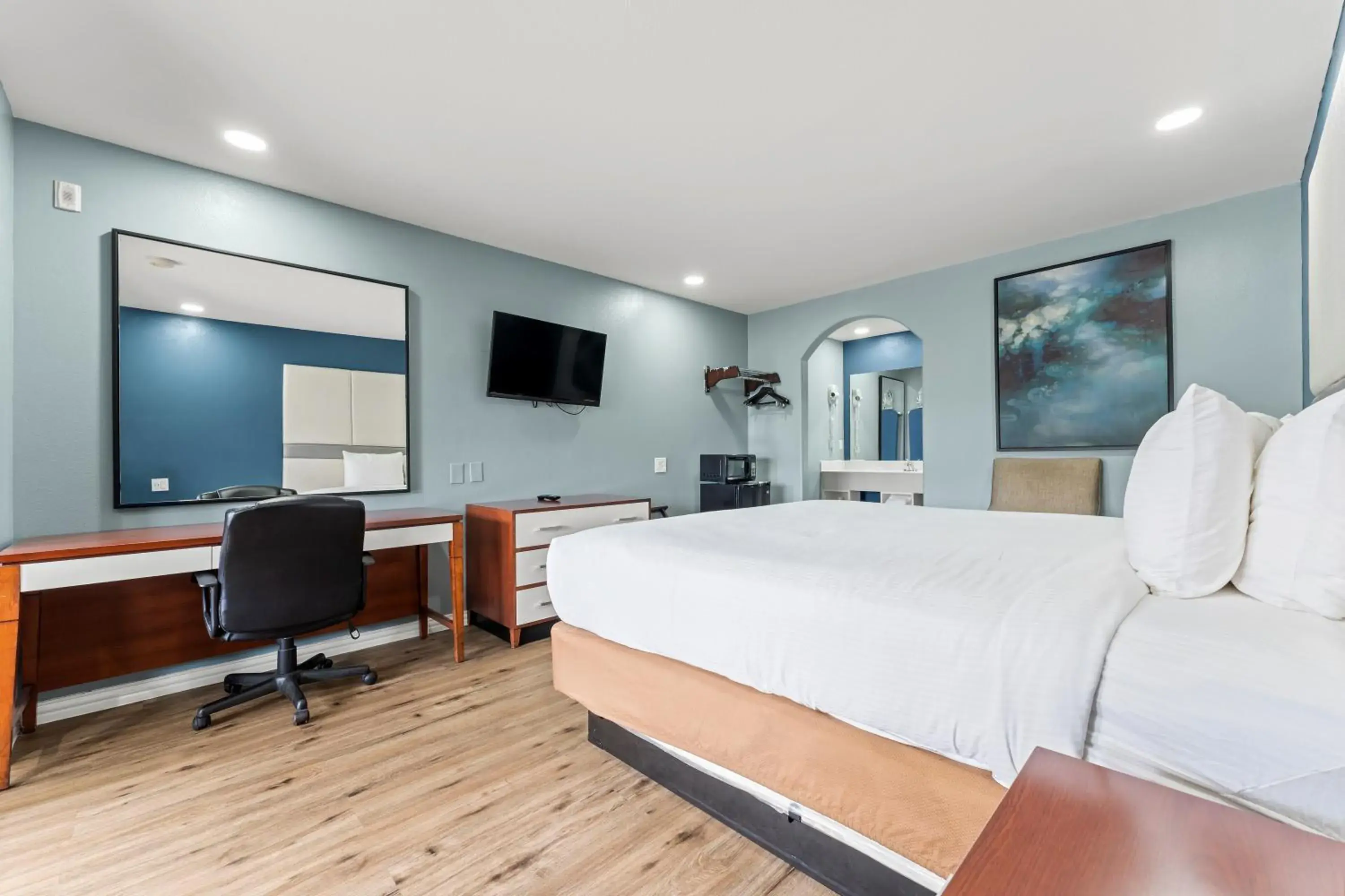 Bed in Executive Inn & Suites Magnolia Bed in Executive Inn & Suites Magnolia