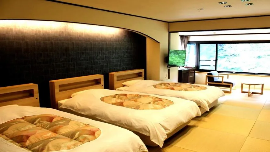 Bed in Hotel Okuyumoto