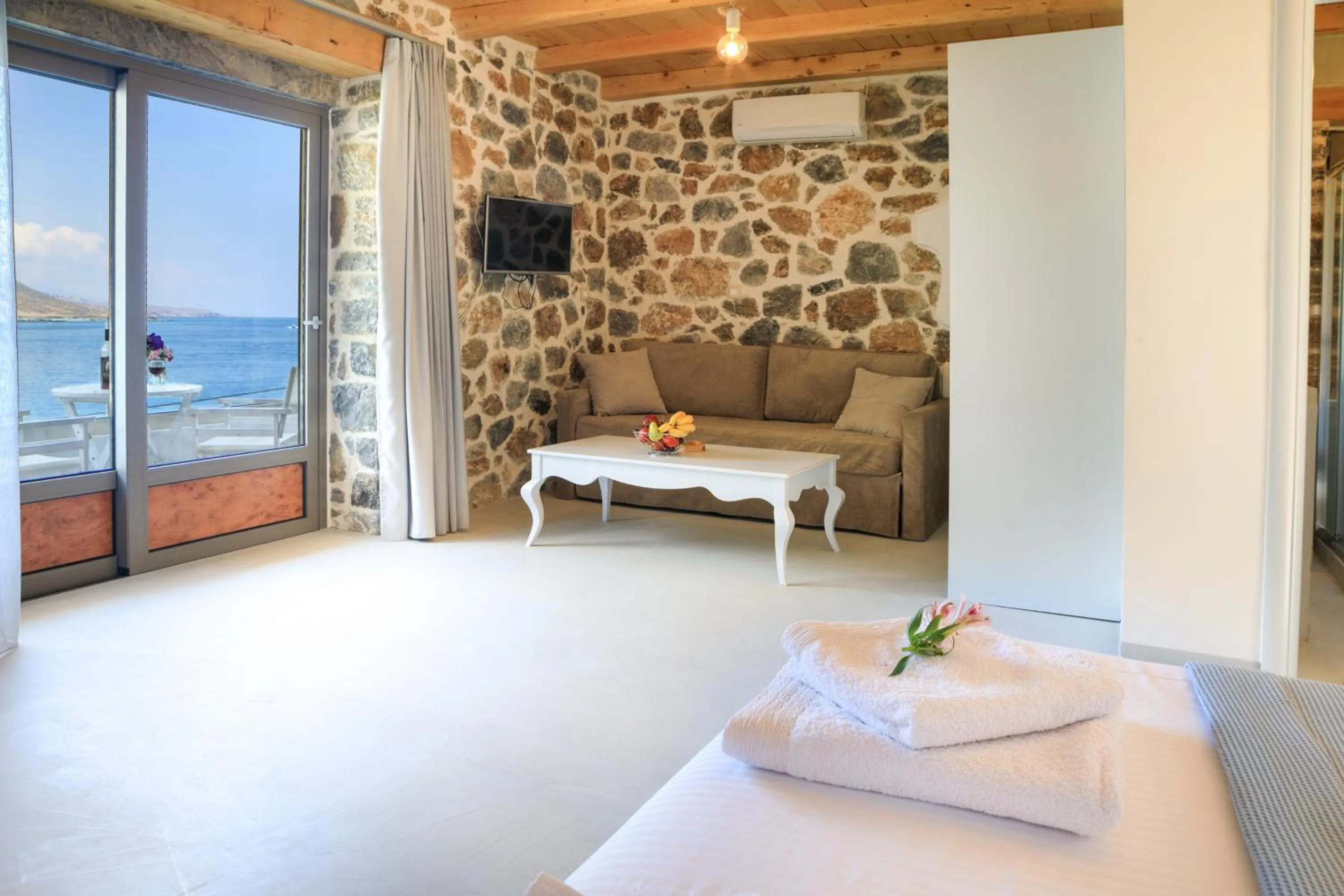 Living room, Bed in Molos Apartments