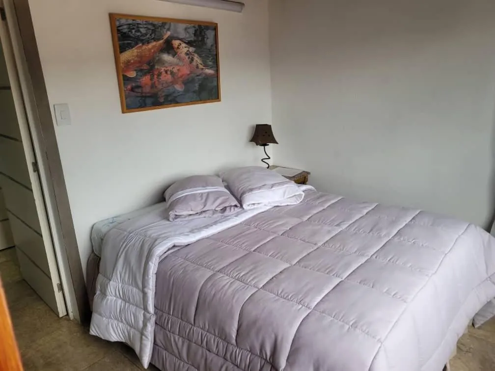 Bedroom, Bed in Apartamento tipo estudio