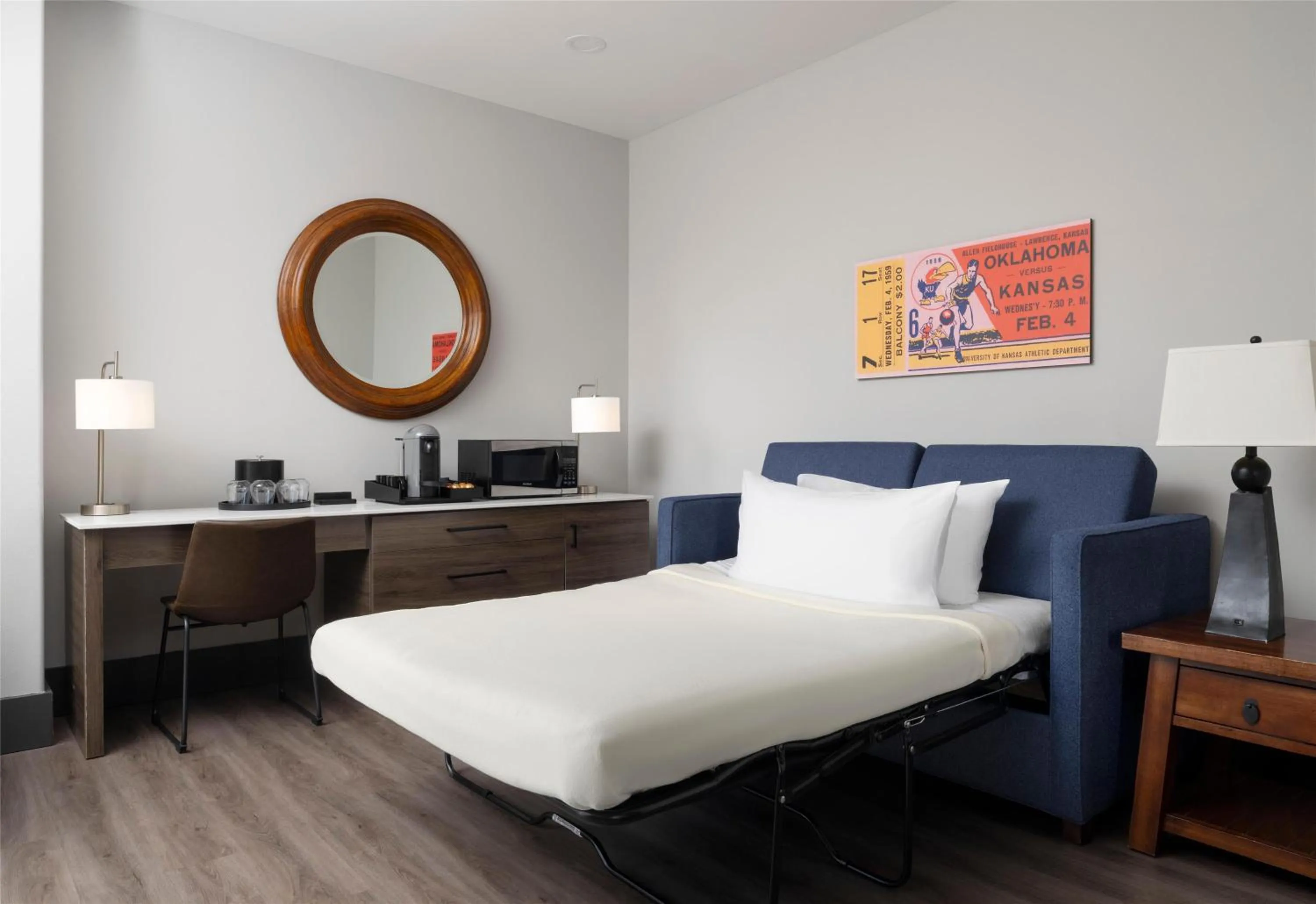 Living room, Bed in The Oread Lawrence, Tapestry Collection by Hilton