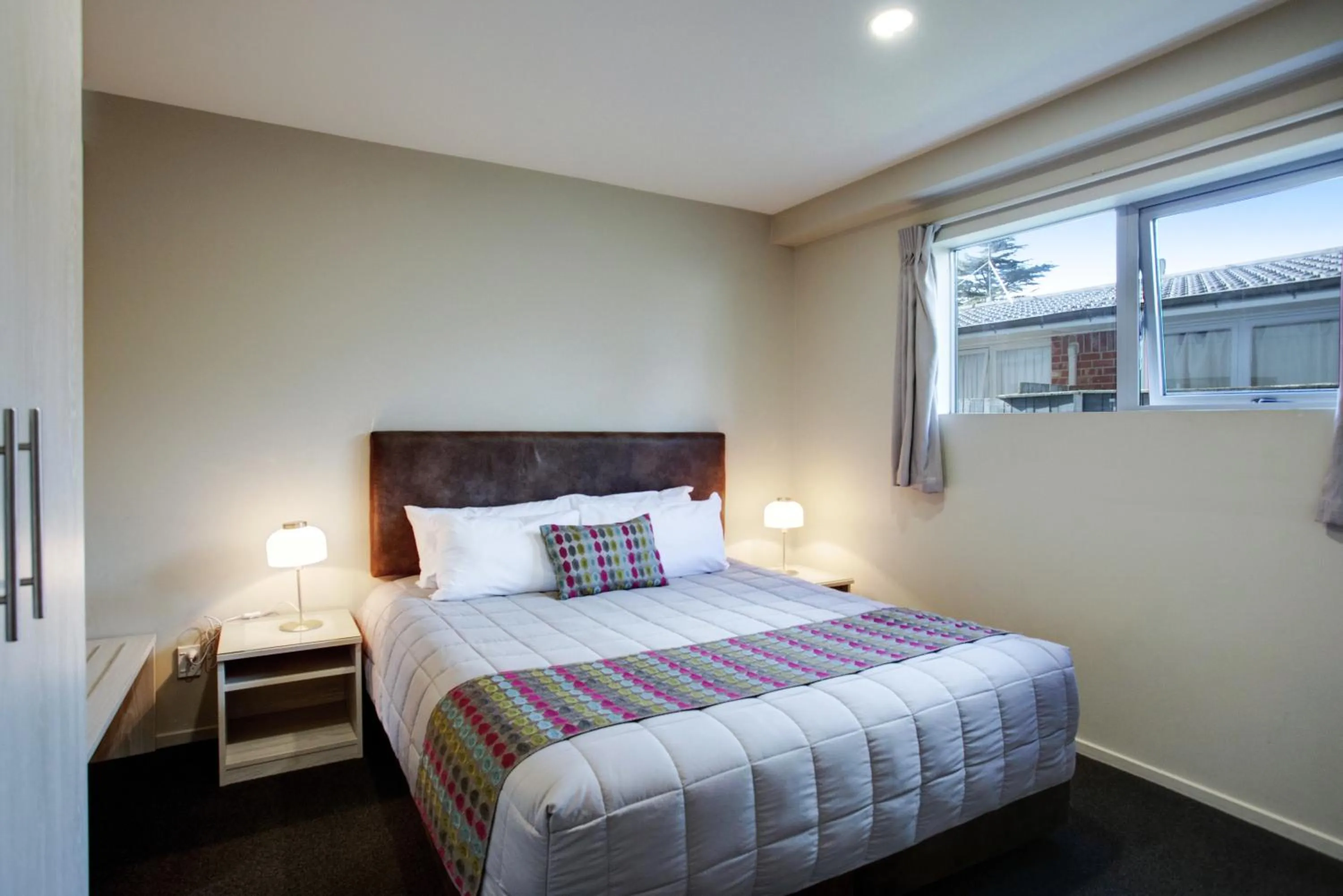 Bed in Ellerslie Palms Motel