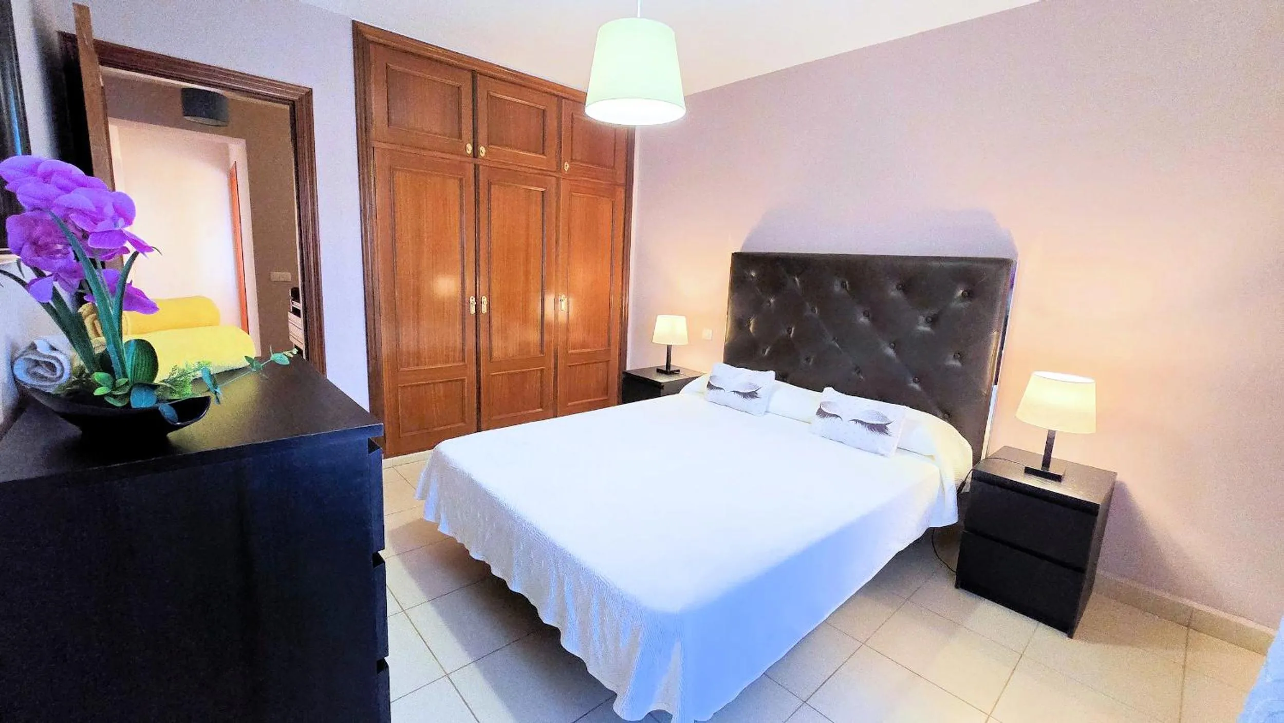 Bed in Evita Beach Suites Exclusivas